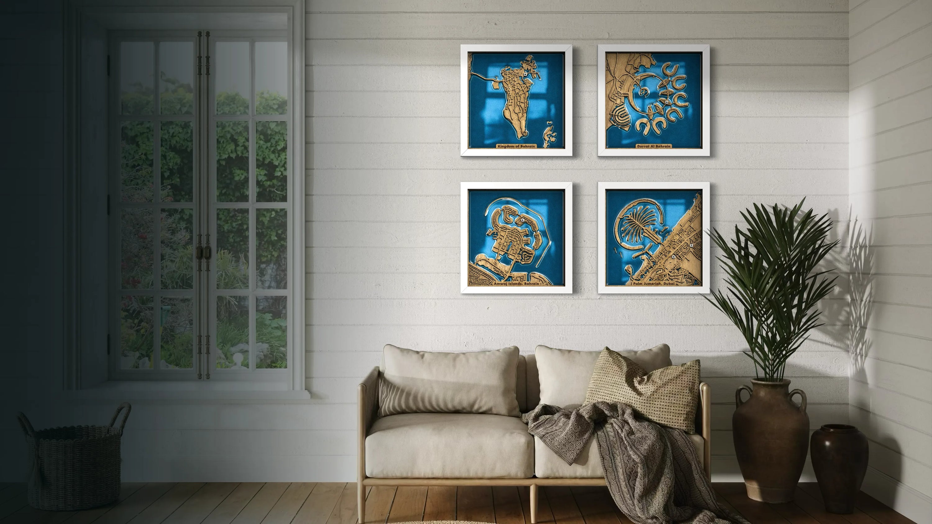 Living room with a sofa, decorative pillows, and framed artwork on the wall.