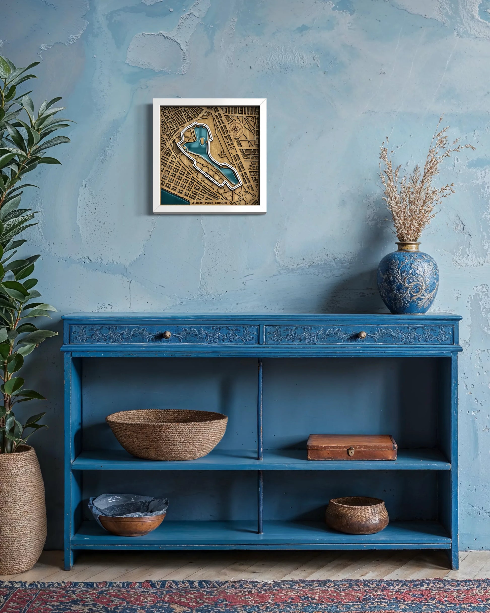 Handcrafted Albert Park Circuit layered wooden racetrack wall art with epoxy resin waters displayed in a modern living room with a white frame