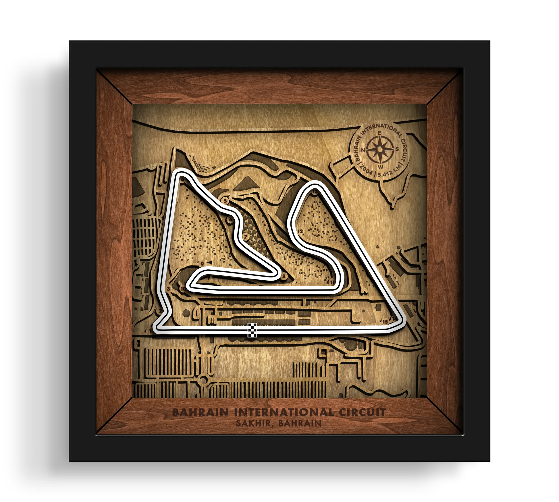 Handcrafted Bahrain International Circuit layered wooden racetrack wall art in a black frame.