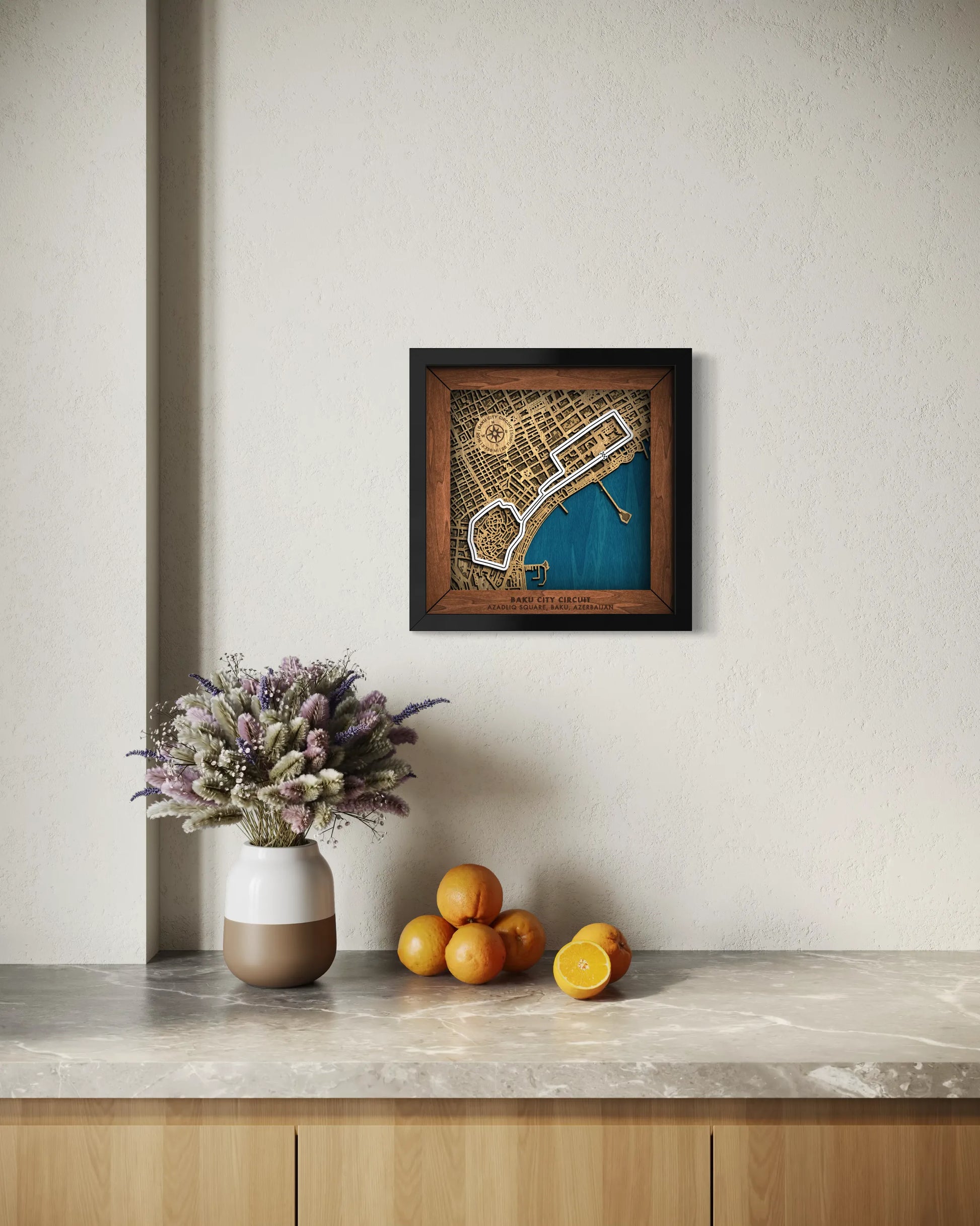 Handcrafted Baku City Circuit layered wooden racetrack wall art displayed in a modern living room with a white frame.
