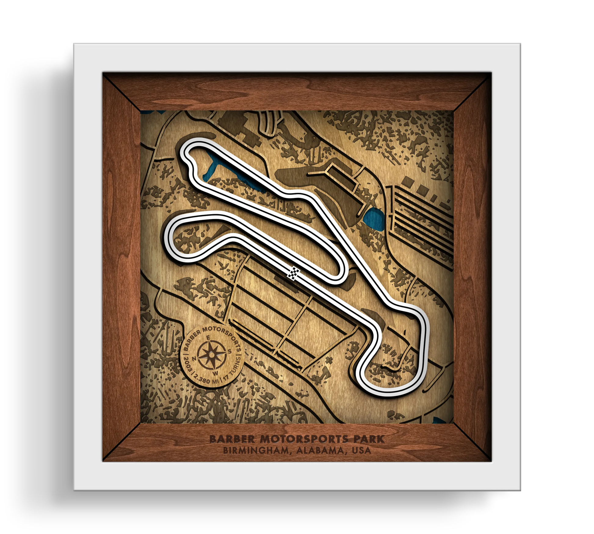 Handcrafted Barber Motorsports Park layered wooden racetrack wall art in a white frame.