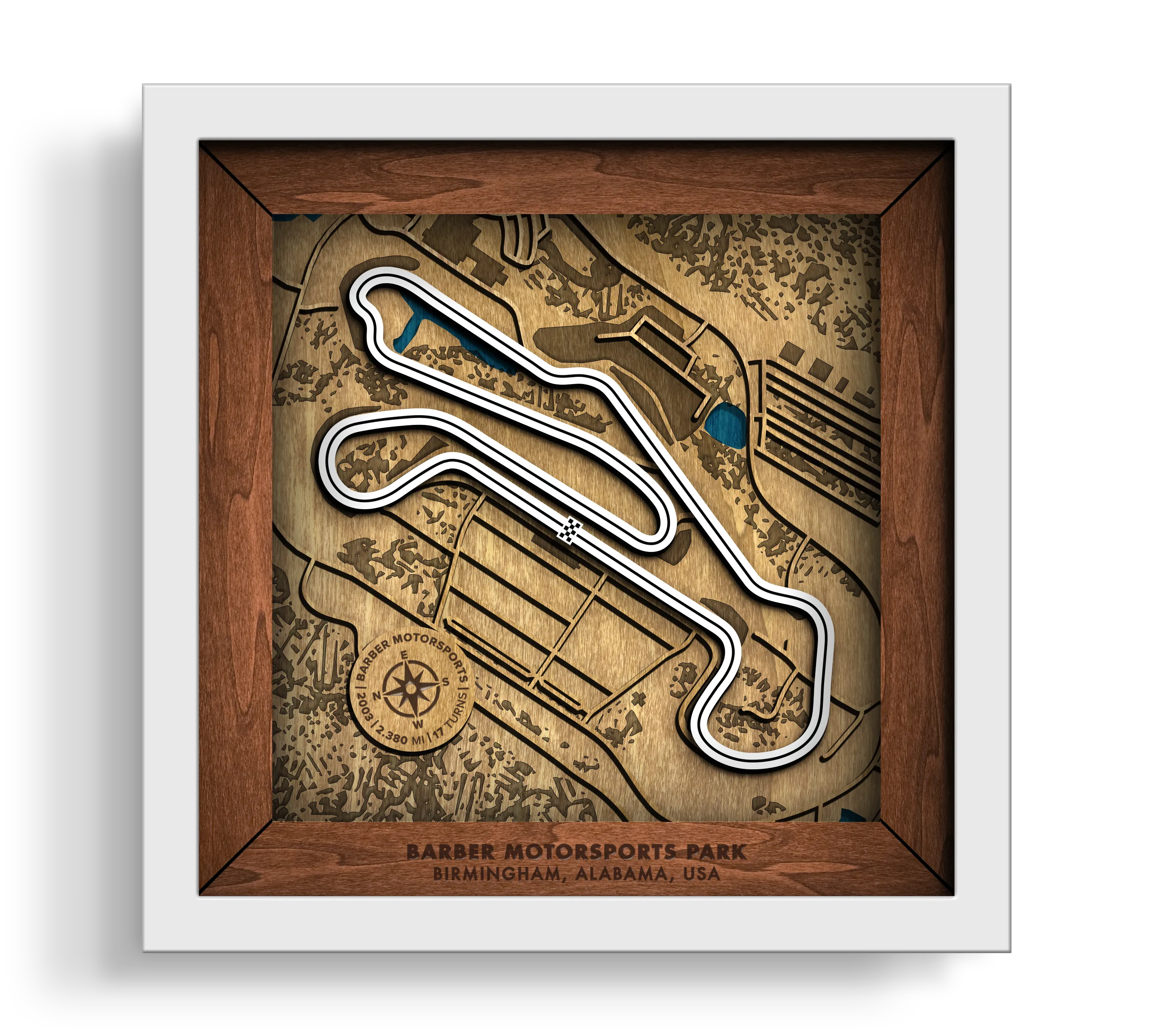 Handcrafted Barber Motorsports Park layered wooden racetrack wall art in a white frame.