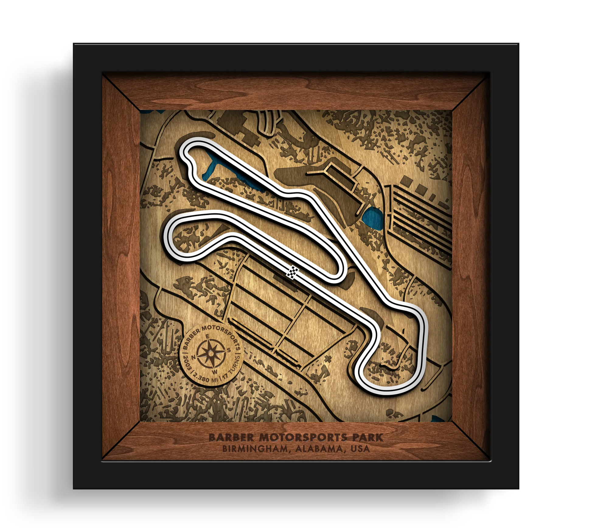 Handcrafted Barber Motorsports Park layered wooden racetrack wall art in a black frame.