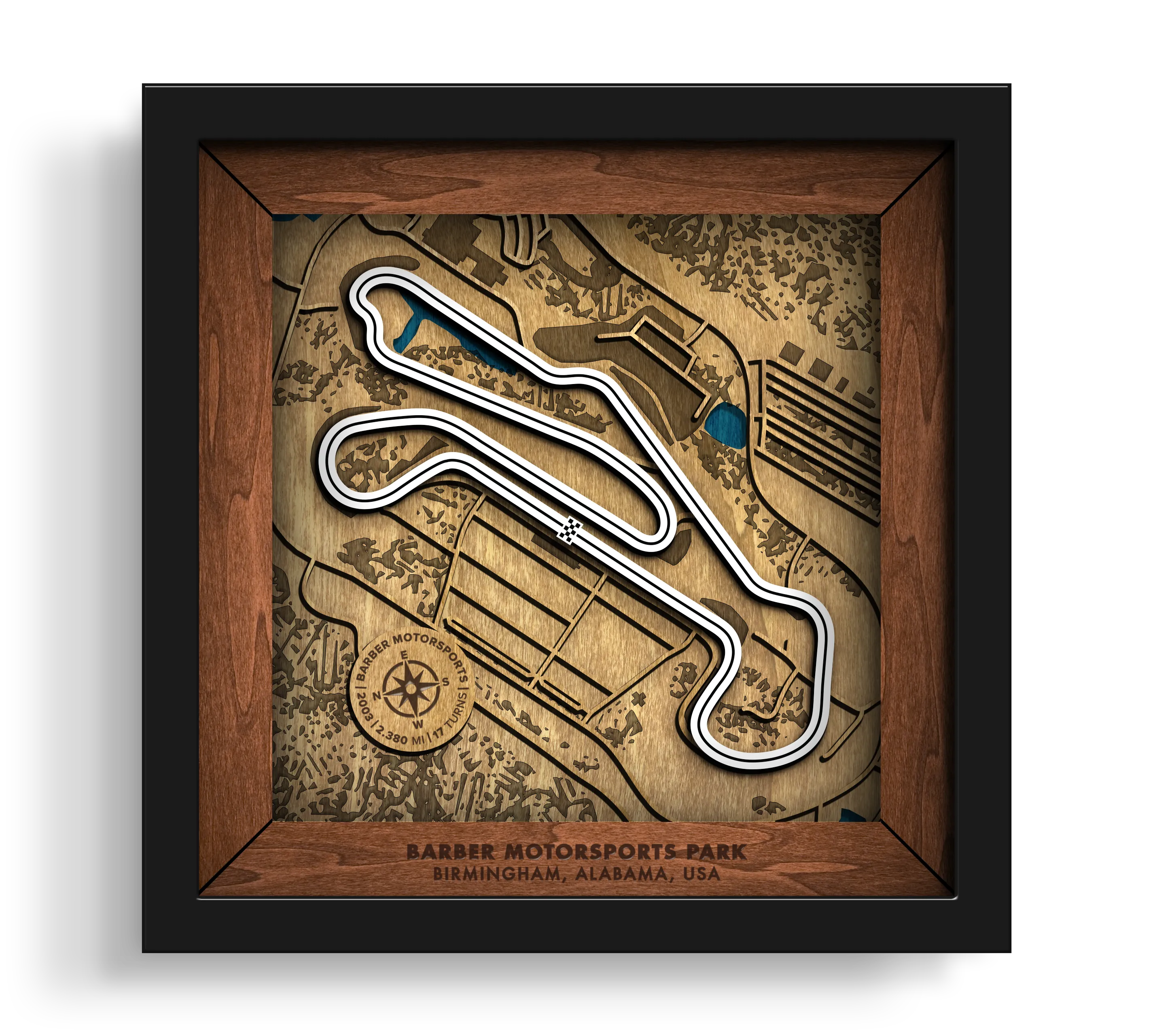 Handcrafted Barber Motorsports Park layered wooden racetrack wall art in a black frame.
