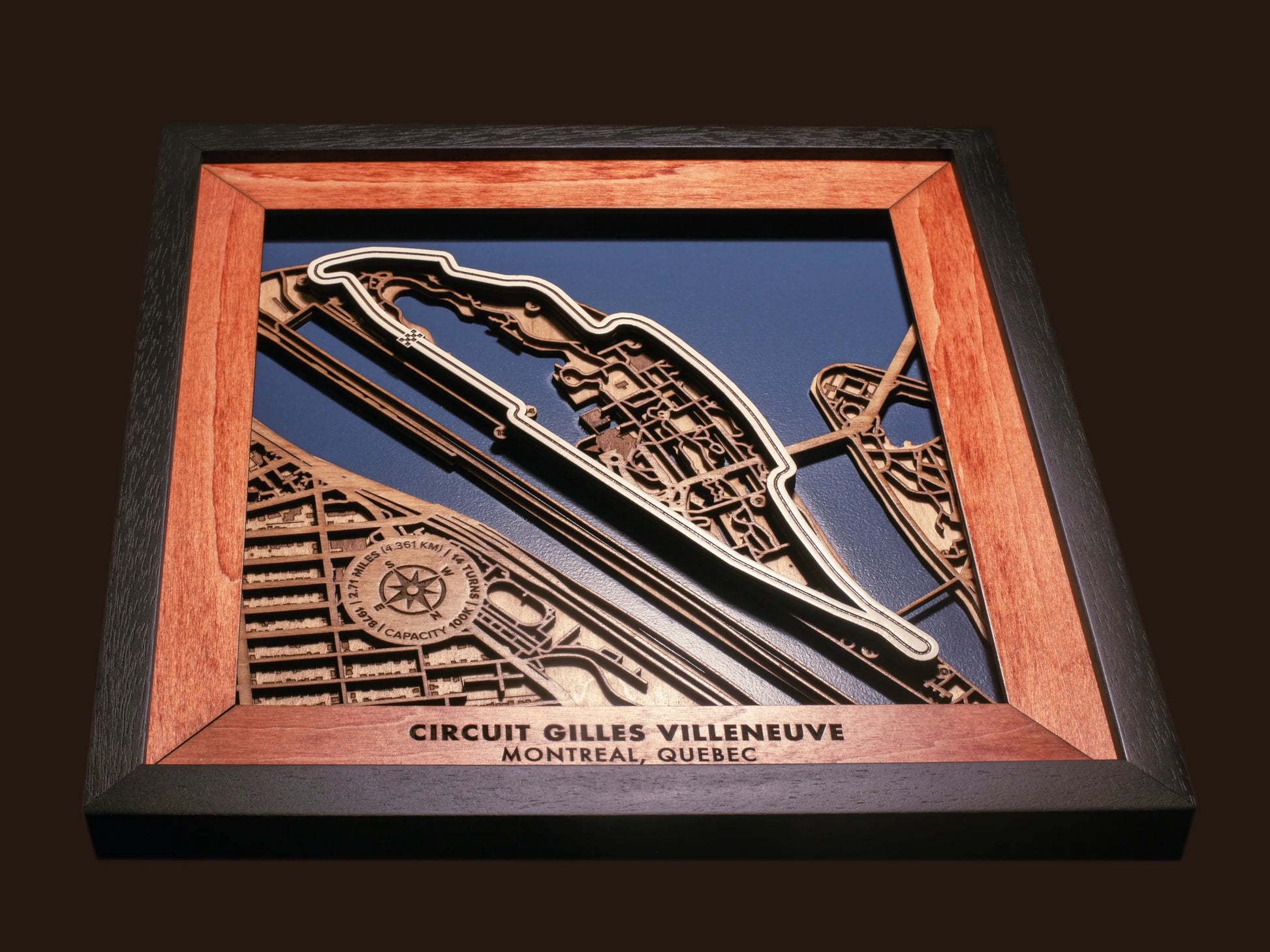 Close-up of the handcrafted layered wood construction and fine details of the Circuit Gilles Villeneuve wall art.