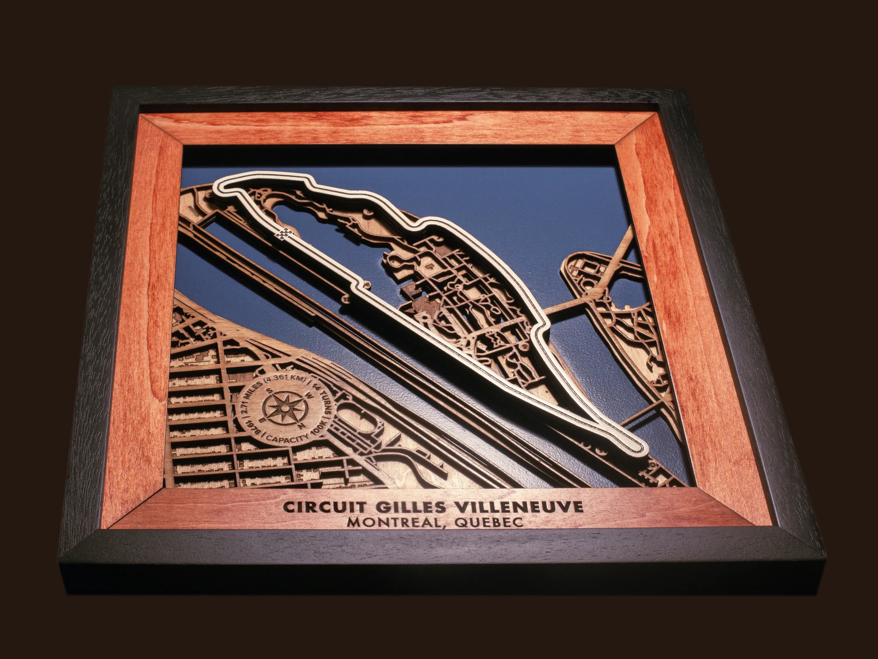 Close-up of the handcrafted layered wood construction and fine details of the Circuit Gilles Villeneuve wall art.