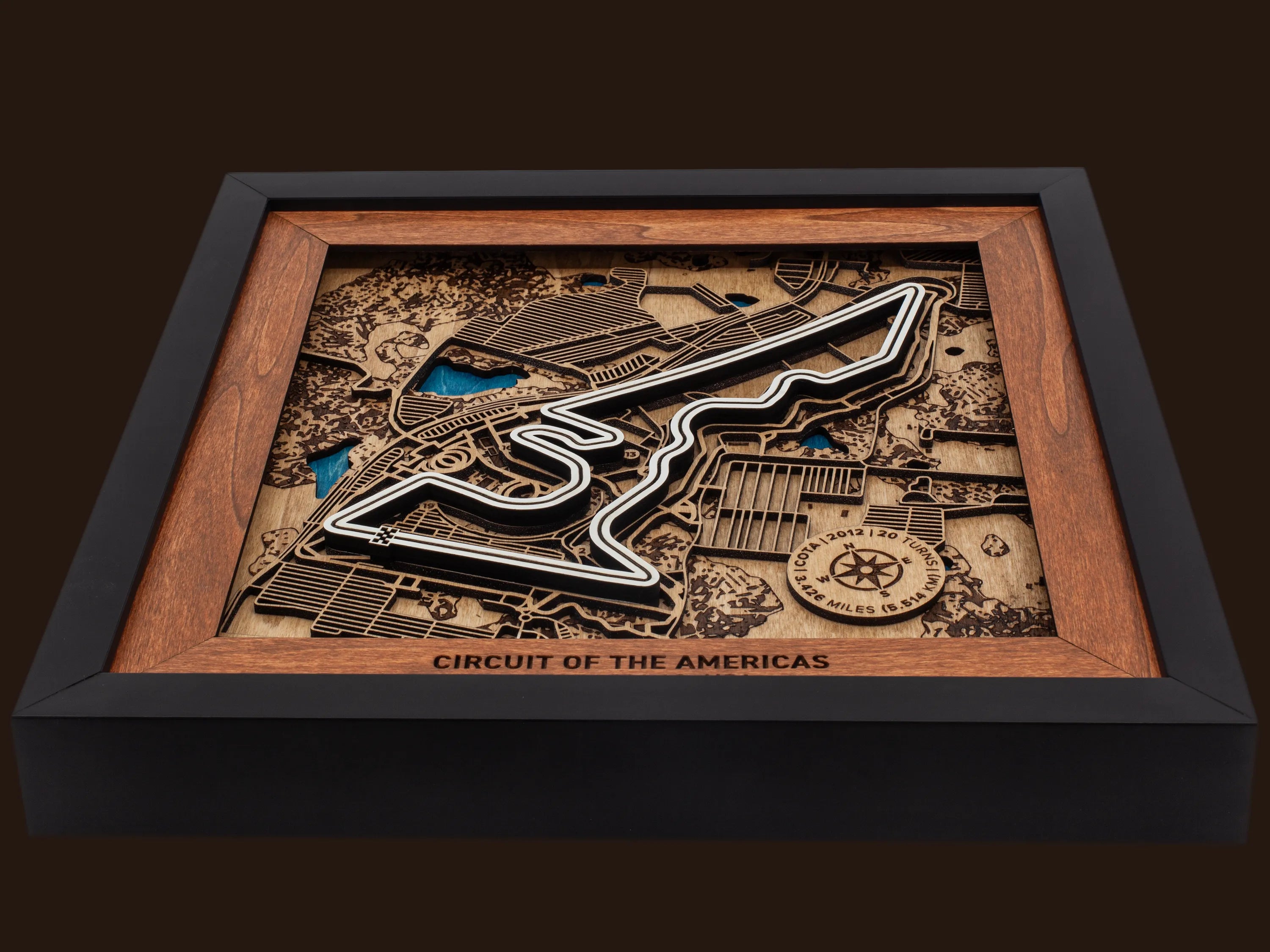 Close-up of the handcrafted layered wood construction and fine details of the Circuit of The Americas¨ wall art.