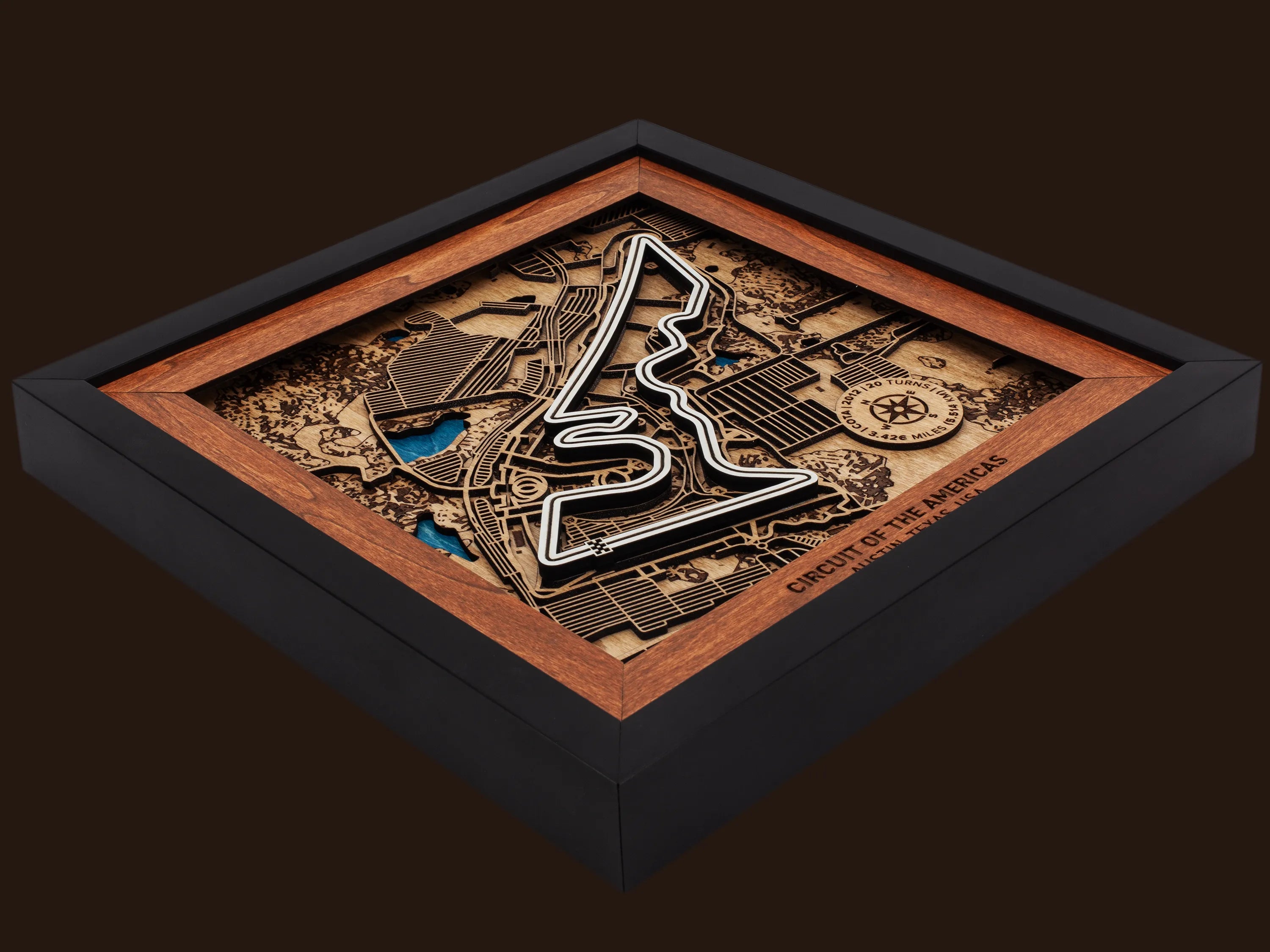 Close-up of the handcrafted layered wood construction and fine details of the Circuit of The Americas¨ wall art.