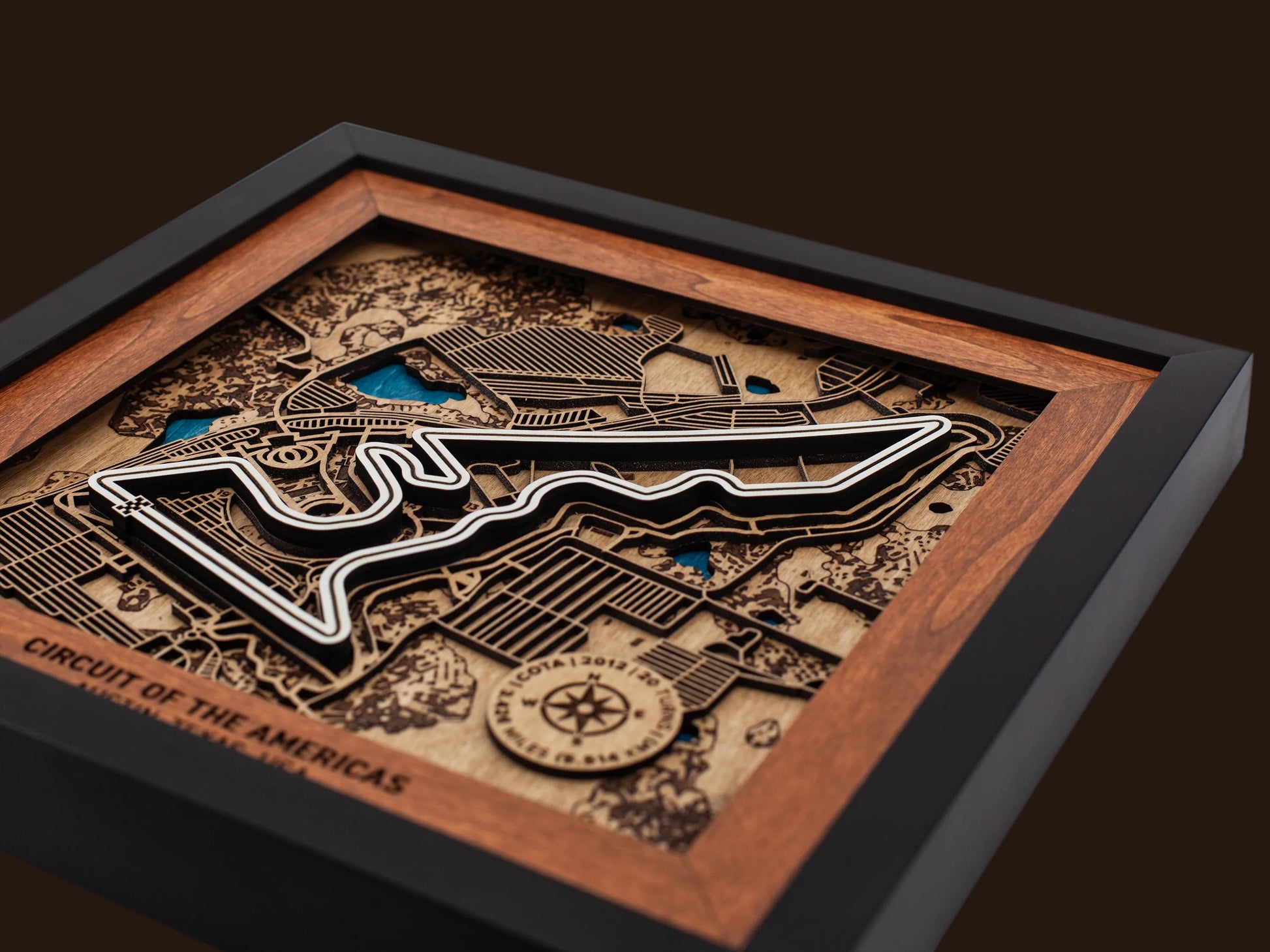 Close-up of the handcrafted layered wood construction and fine details of the Circuit of The Americas¨ wall art.
