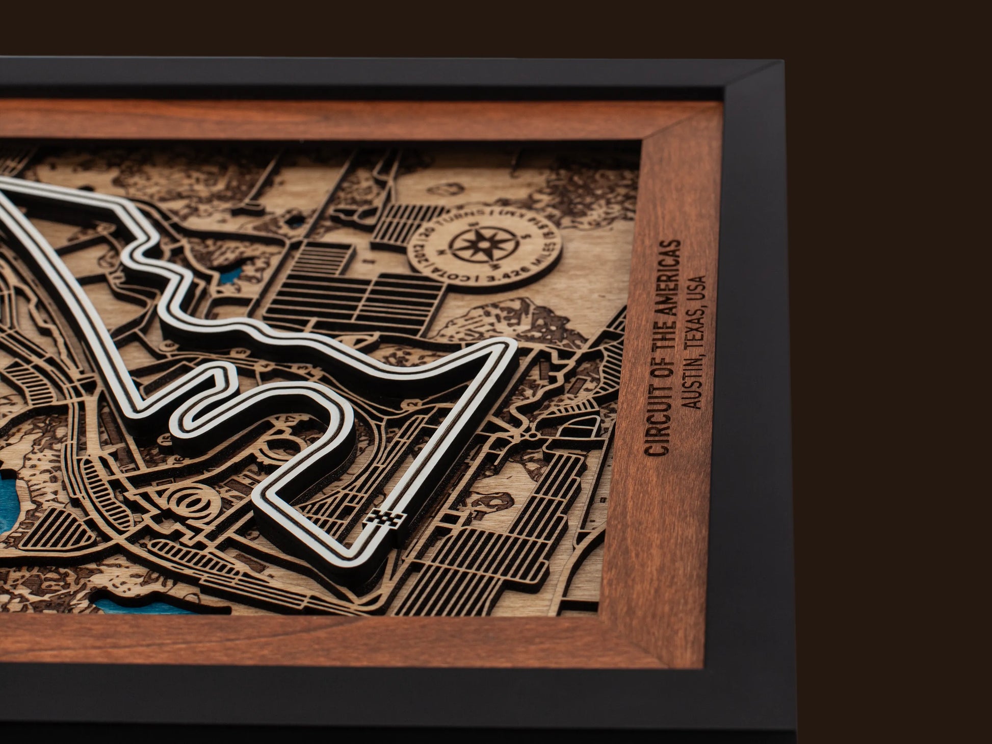 Close-up of the handcrafted layered wood construction and fine details of the Circuit of The Americas¨ wall art.