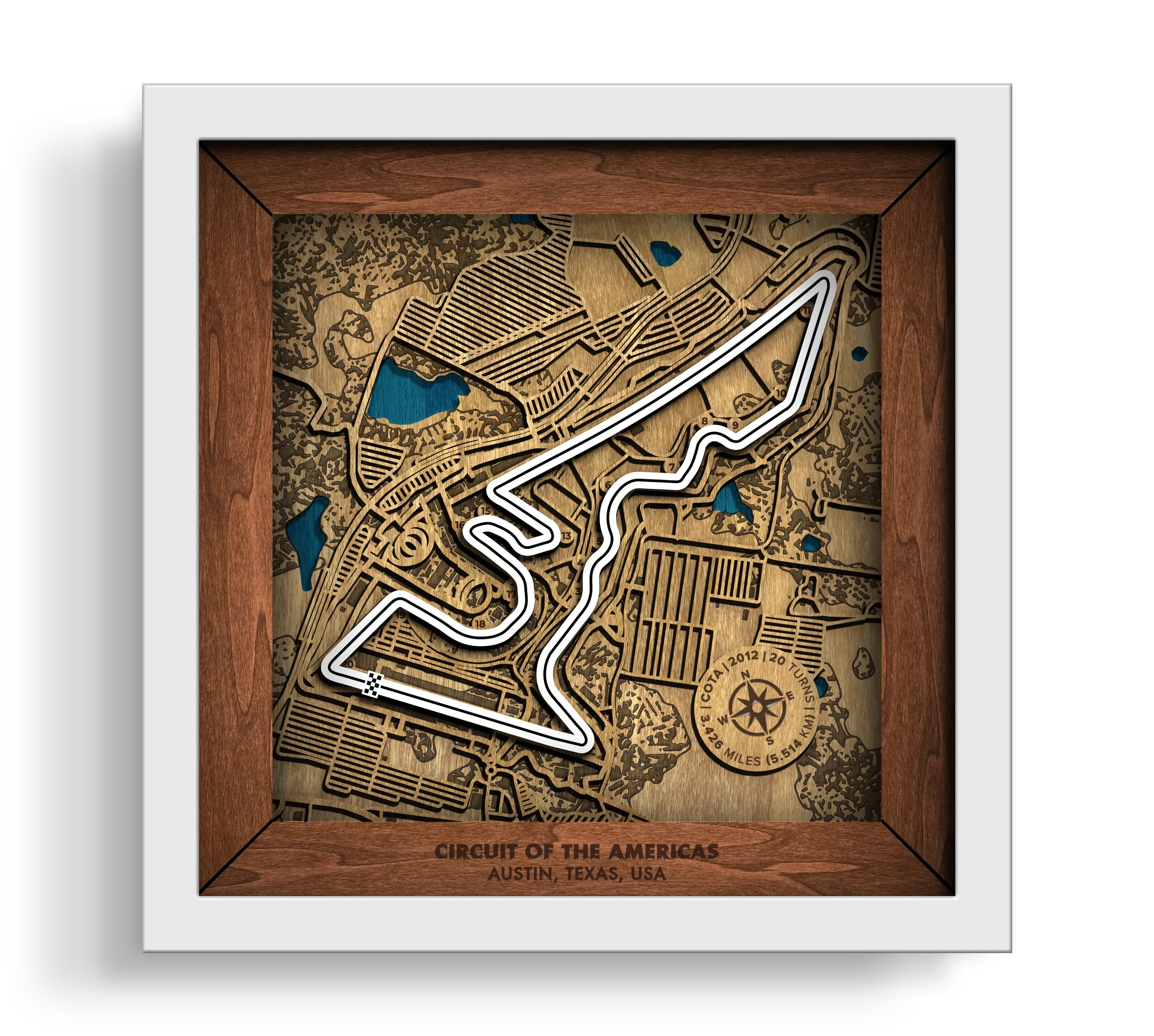 Handcrafted Circuit of The Americas¨ layered wooden racetrack wall art in a white frame.