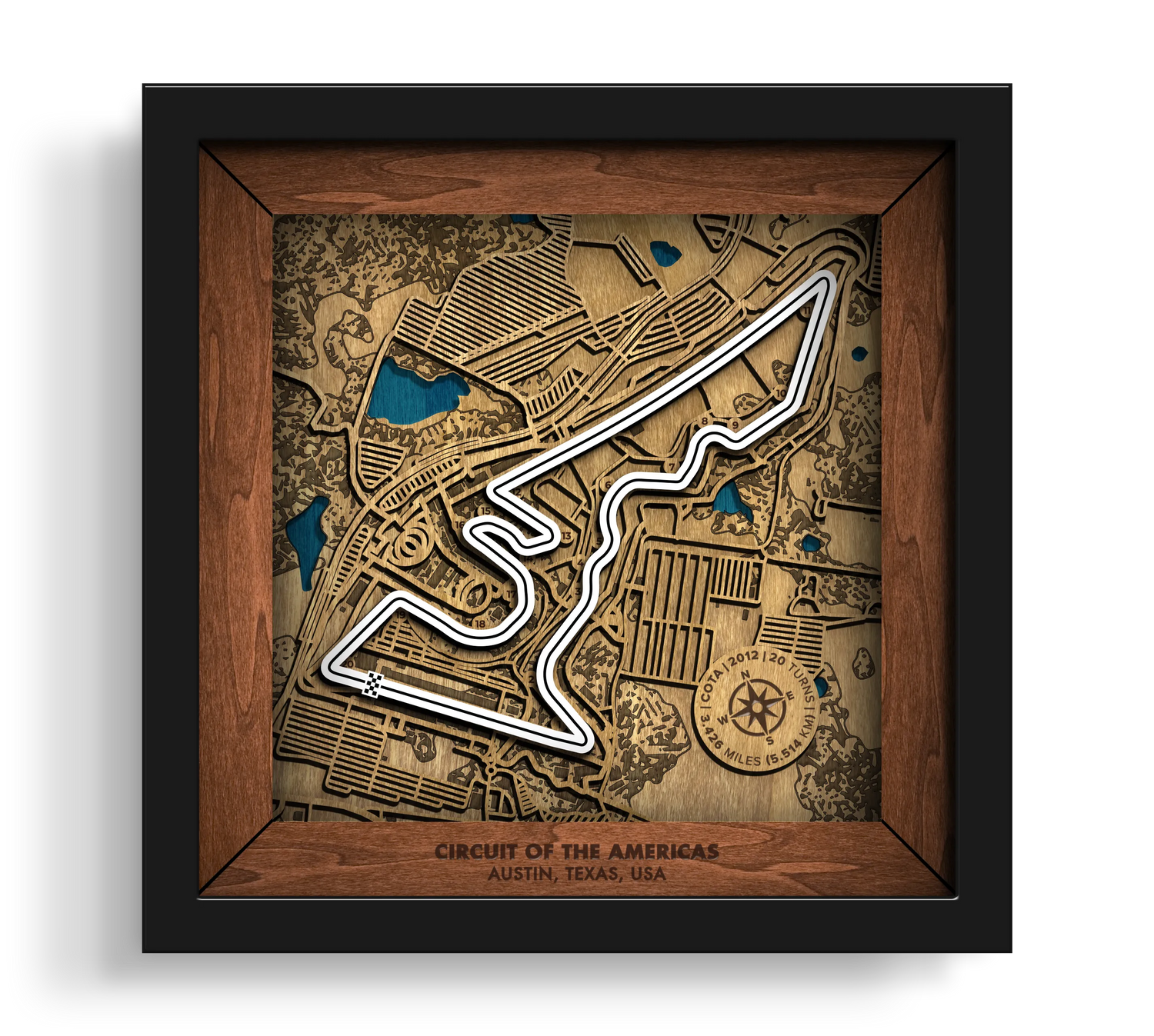 Handcrafted Circuit of The Americas¨ layered wooden racetrack wall art in a black frame.