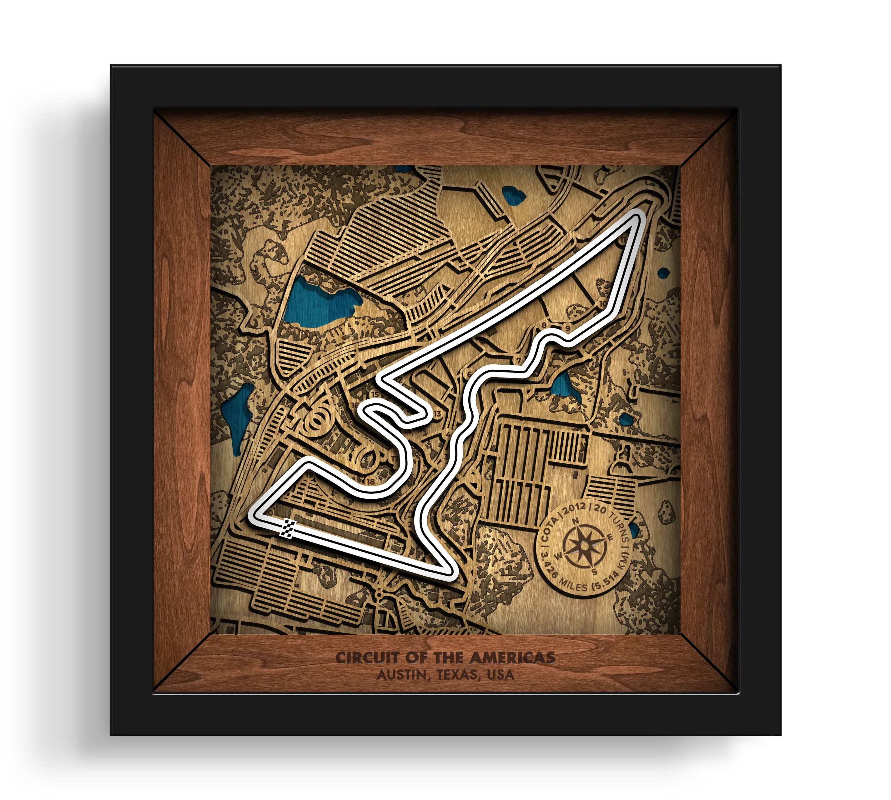 Handcrafted Circuit of The Americas¨ layered wooden racetrack wall art in a black frame.