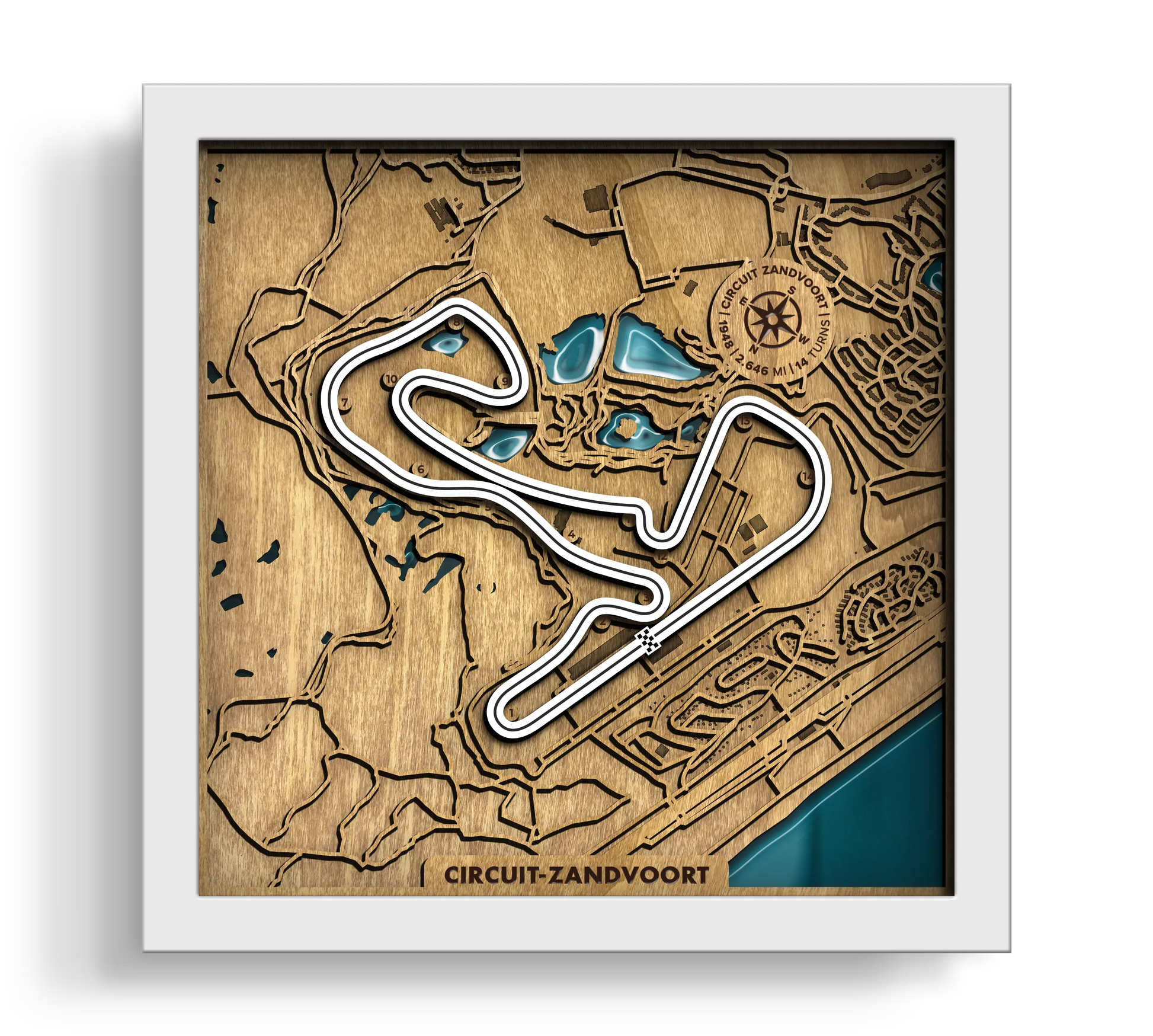Handcrafted Circuit Zandvoort layered wooden racetrack wall art with an epoxy resin finish in a white frame.
