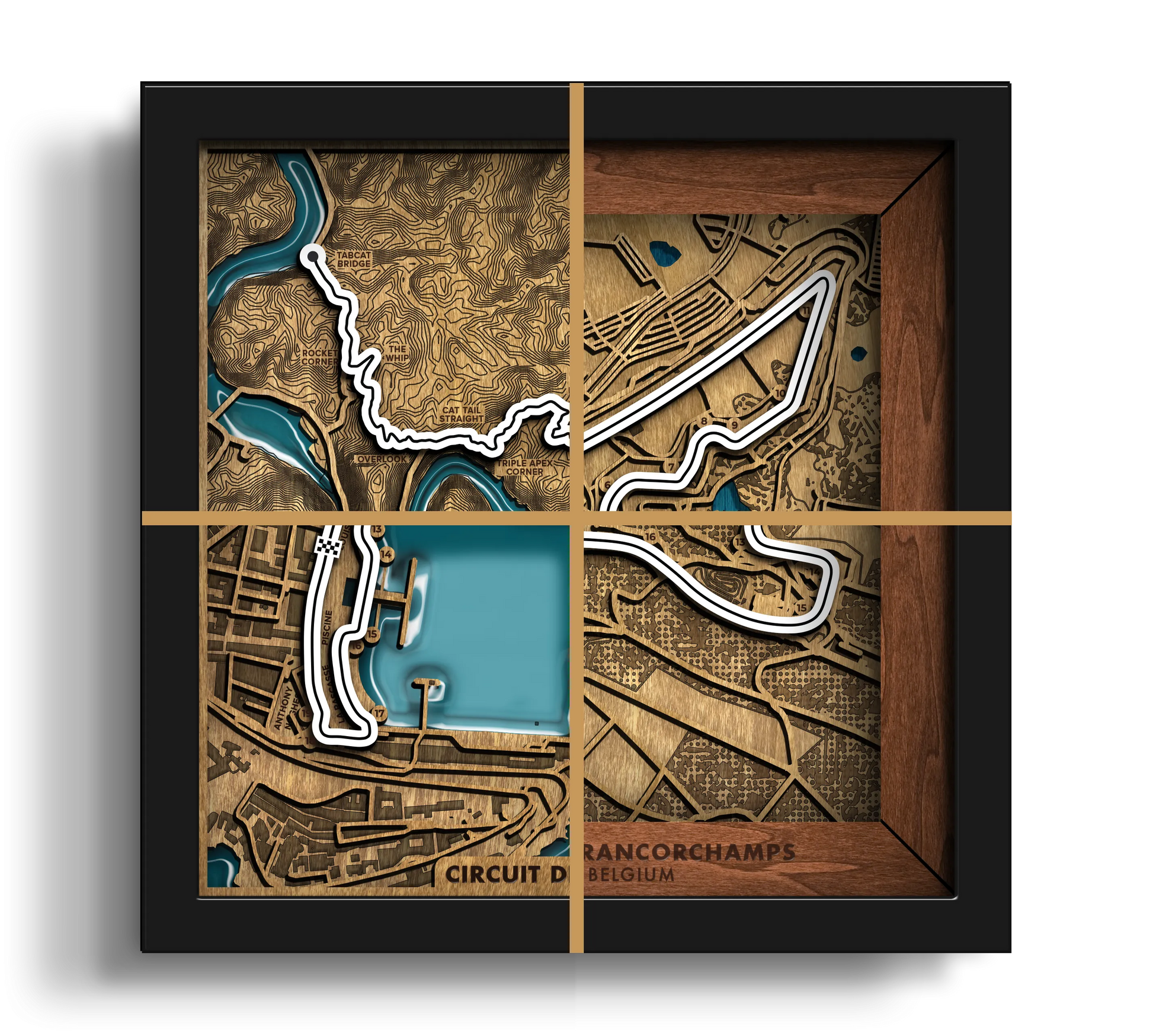 A framed 3D topographical map wall art of the Circuit de Spa-Francorchamps in Belgium, featuring a black frame, gold cross-section lines, and a blue water channel on a textured brown and gold background.