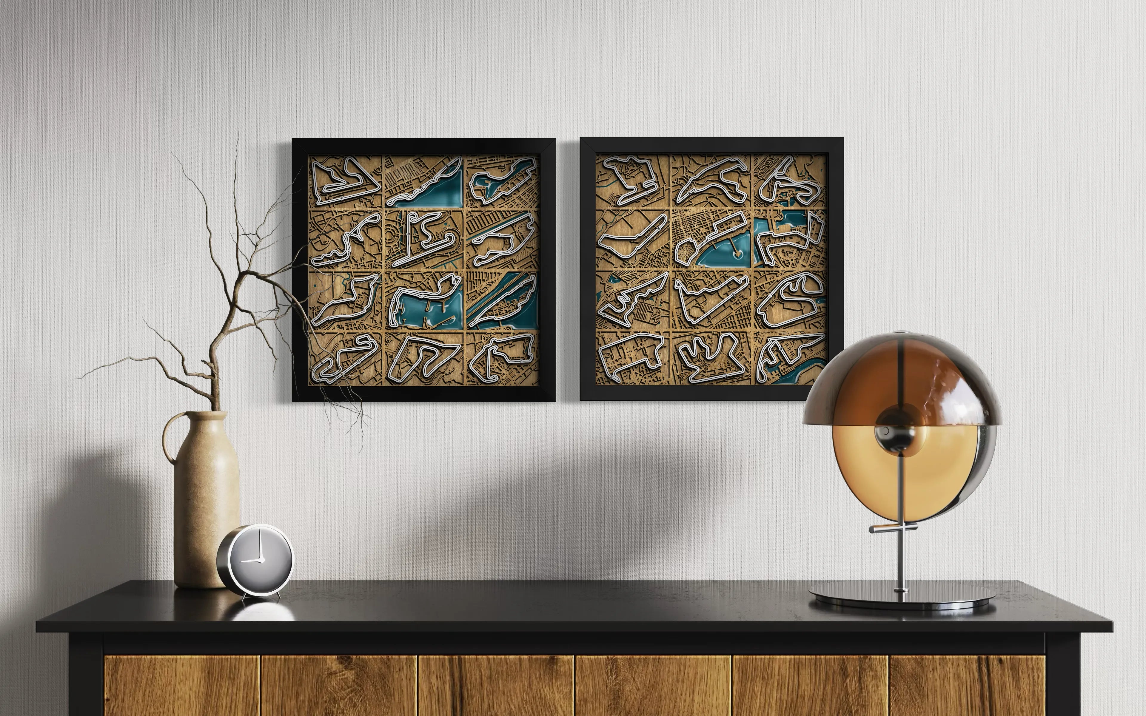 Two square framed wall art pieces with black frames hang on a light gray wall above a dark console table. The artwork features a tan background with a grid of blue and white abstract shapes.