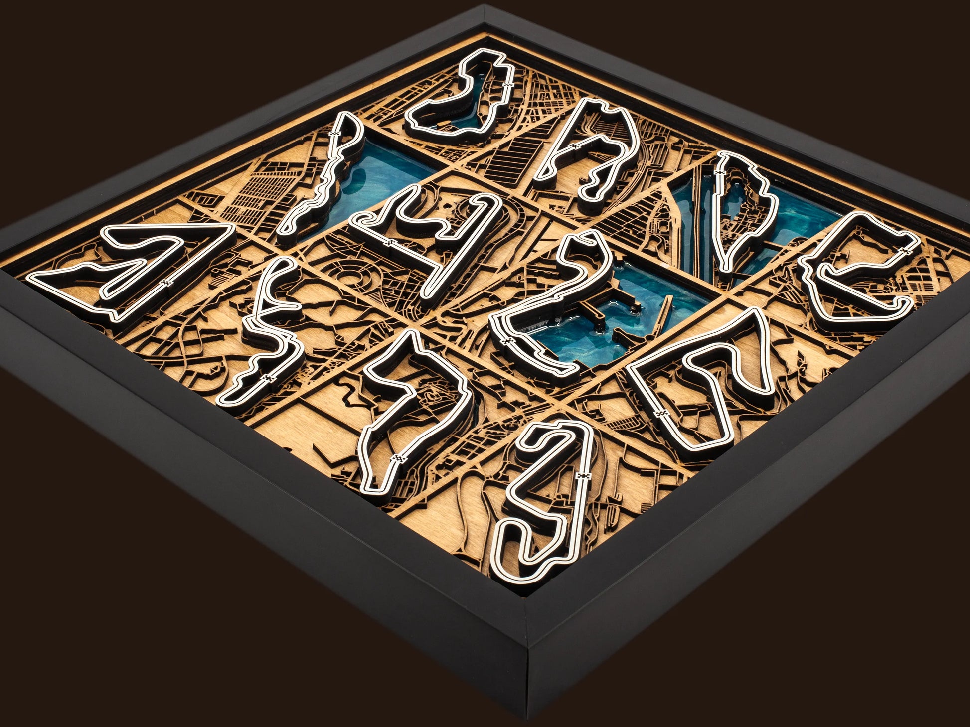 Close-up of the handcrafted layered wood construction and epoxy resin details of the F1 World Collection wall art.