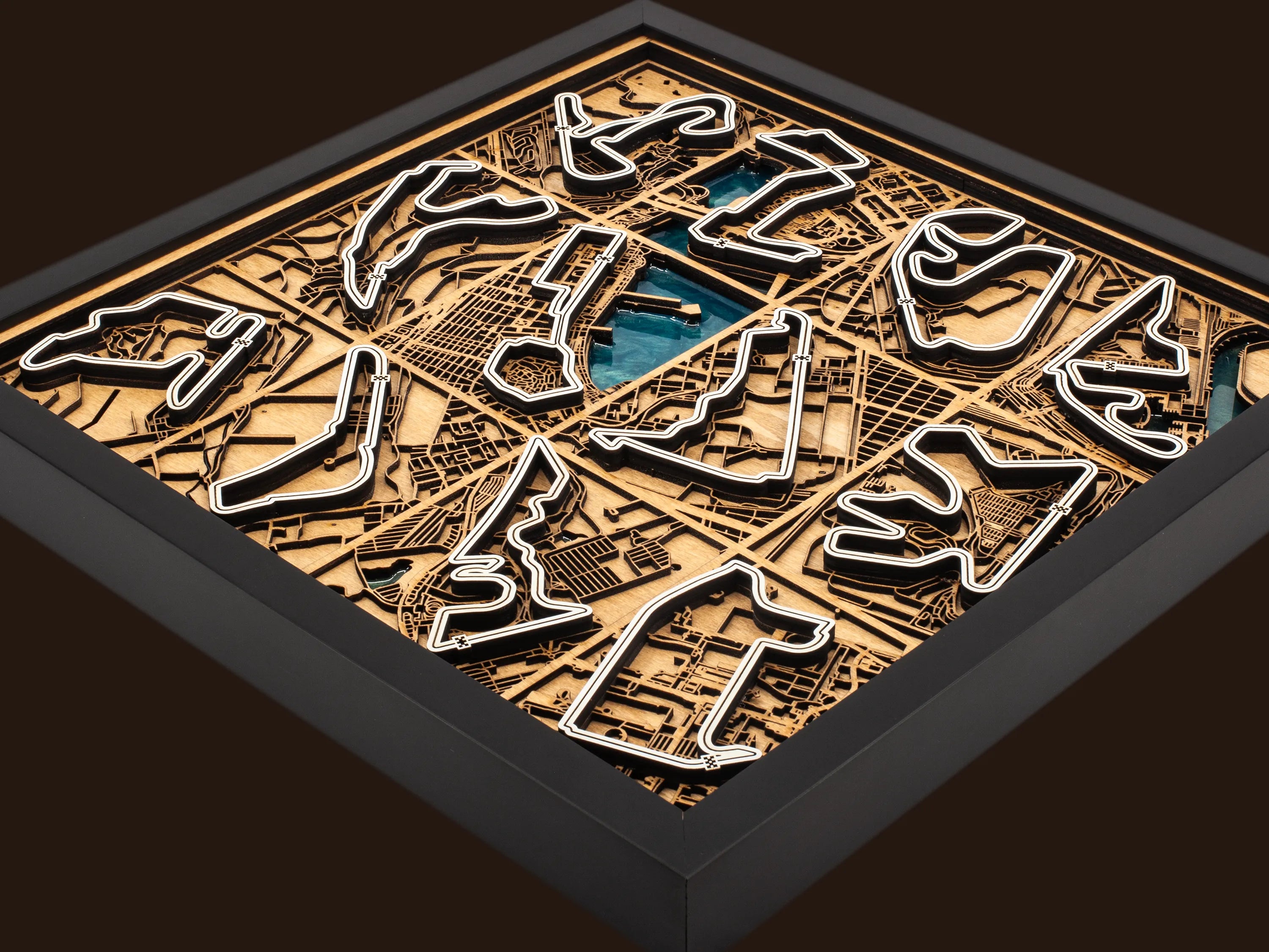 Close-up of the handcrafted layered wood construction and epoxy resin details of the F1 World Collection wall art.