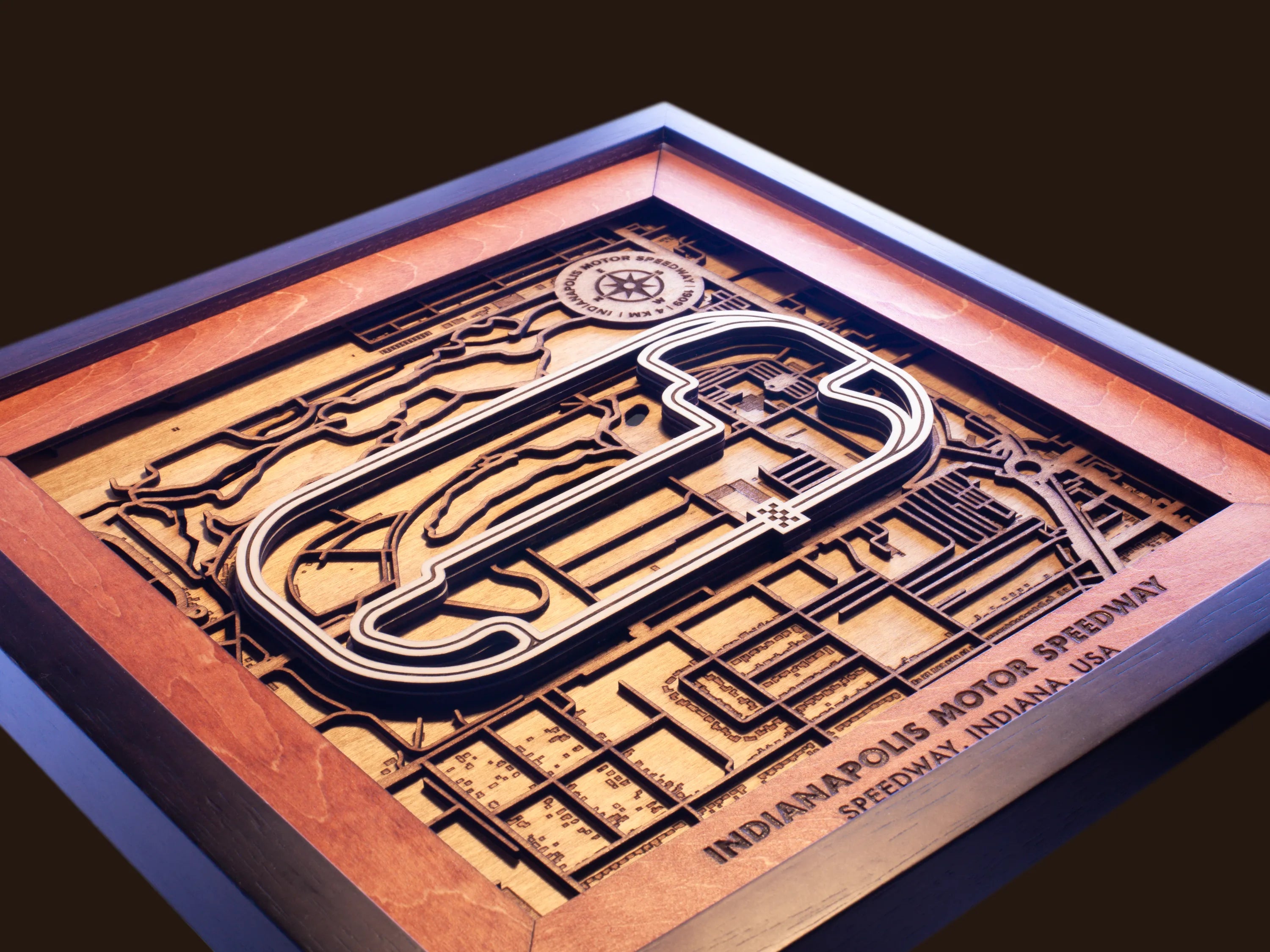Close-up of the handcrafted layered wood construction and fine details of the Indianapolis Motor Speedway wall art.