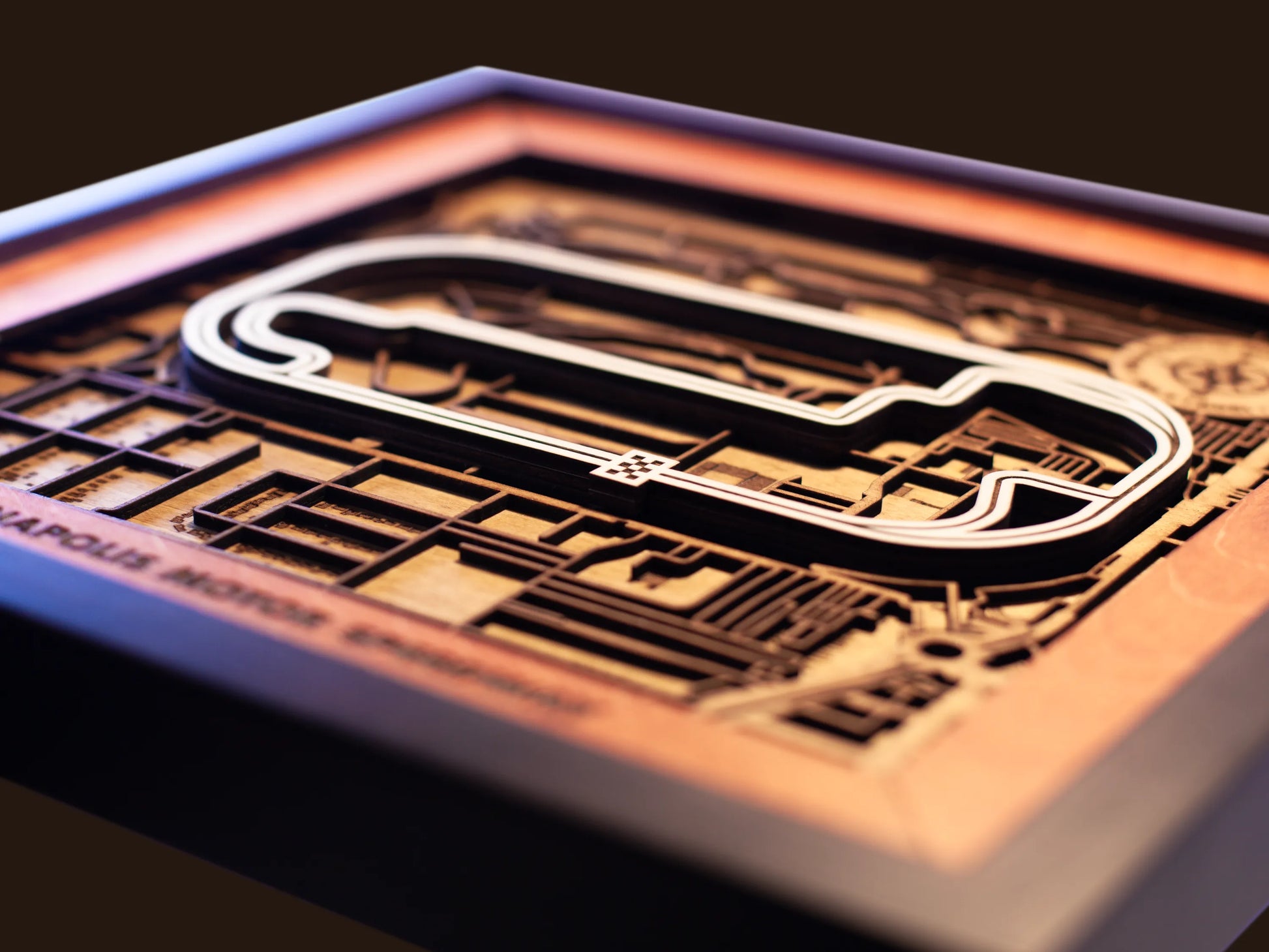 Close-up of the handcrafted layered wood construction and fine details of the Indianapolis Motor Speedway wall art.