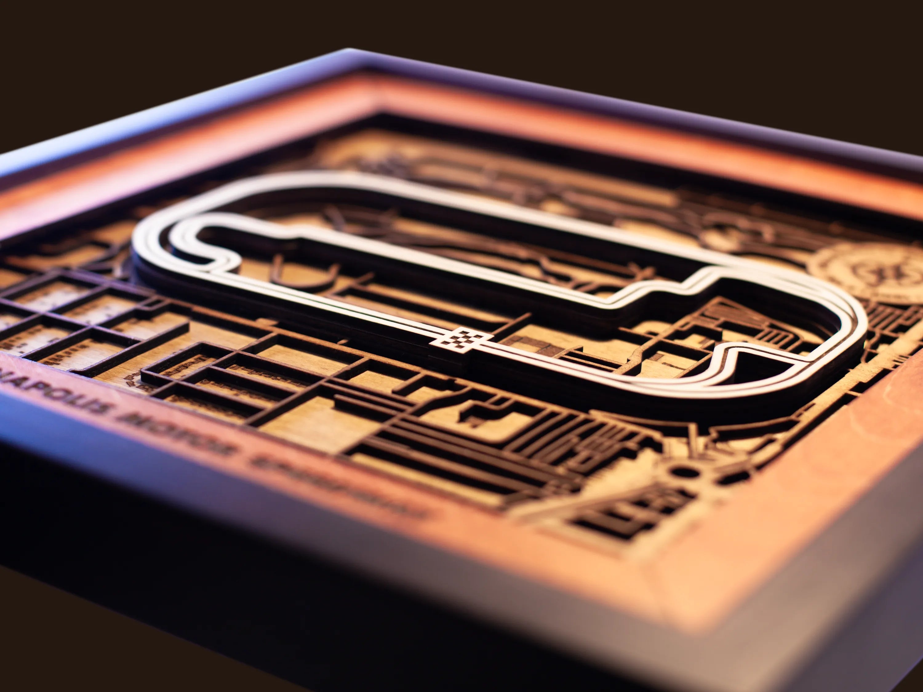 Close-up of the handcrafted layered wood construction and fine details of the Indianapolis Motor Speedway wall art.