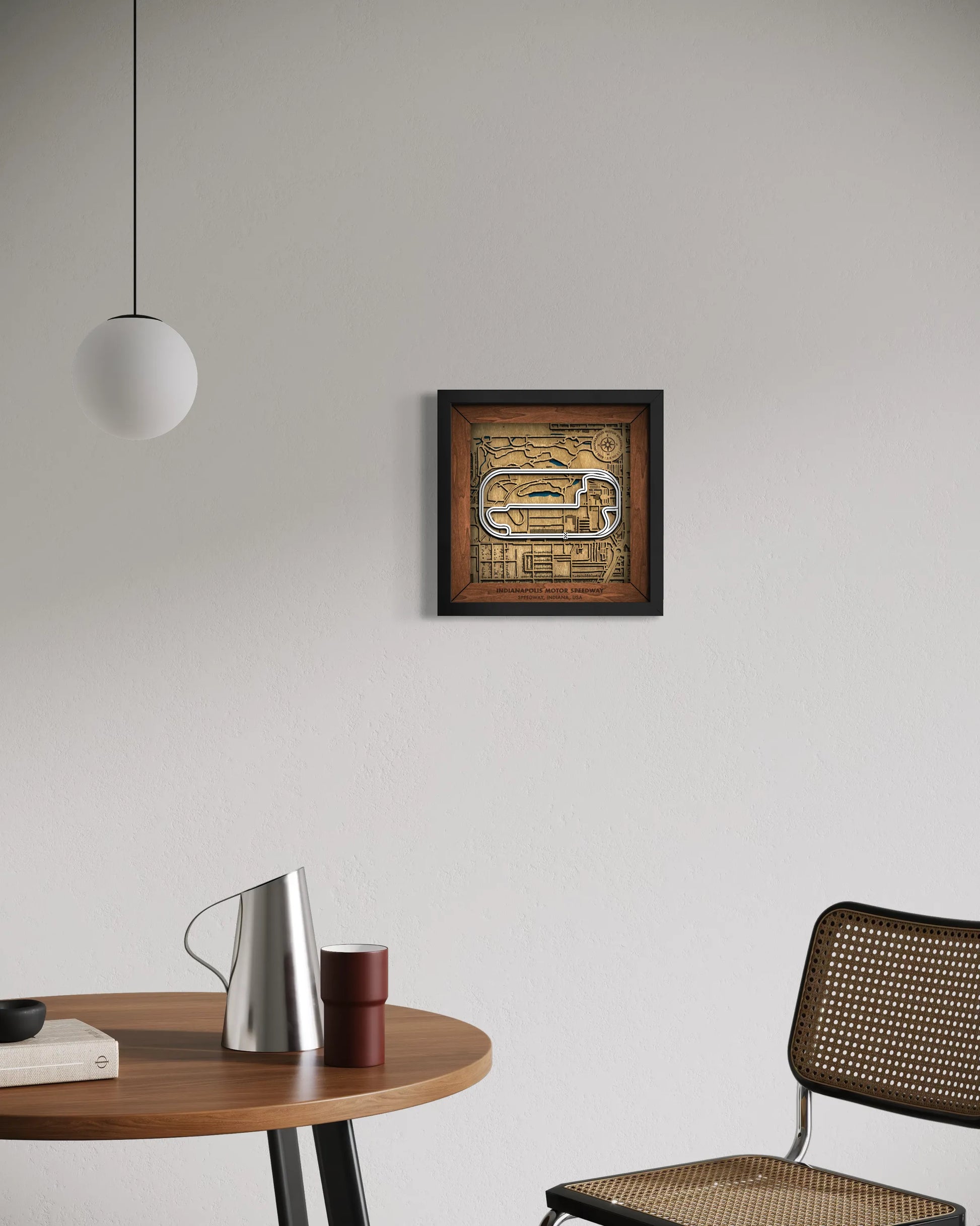 Handcrafted Indianapolis Motor Speedway layered wooden racetrack wall art displayed in a modern living room.