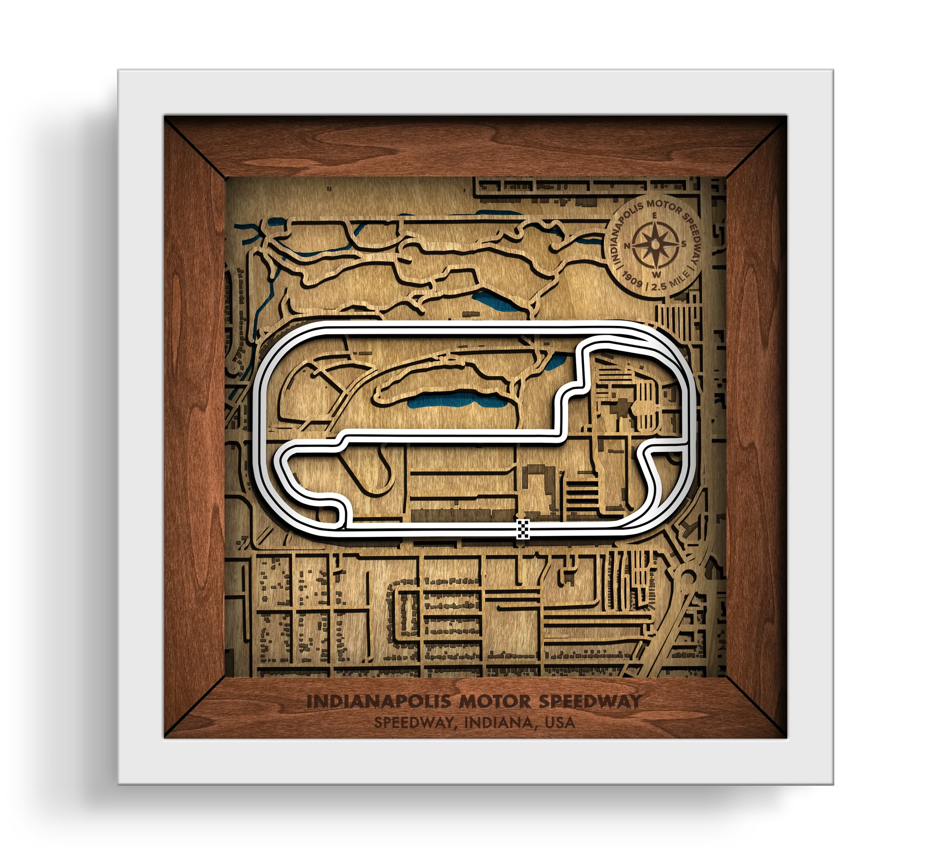 Handcrafted Indianapolis Motor Speedway layered wooden racetrack wall art in a white frame.