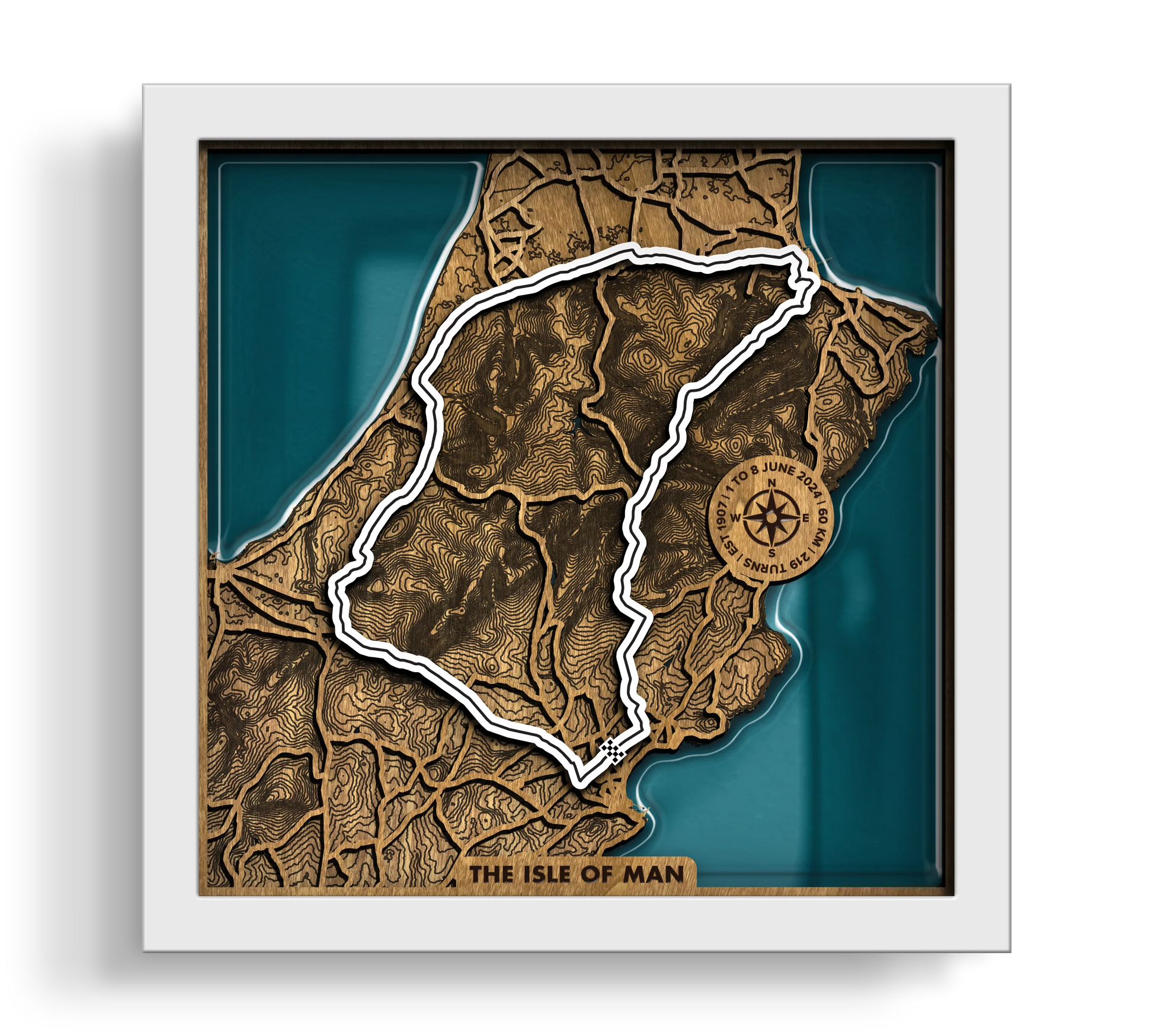 Handcrafted Isle of Man TT Course layered wooden racetrack wall art with an epoxy resin finish in a white frame.
