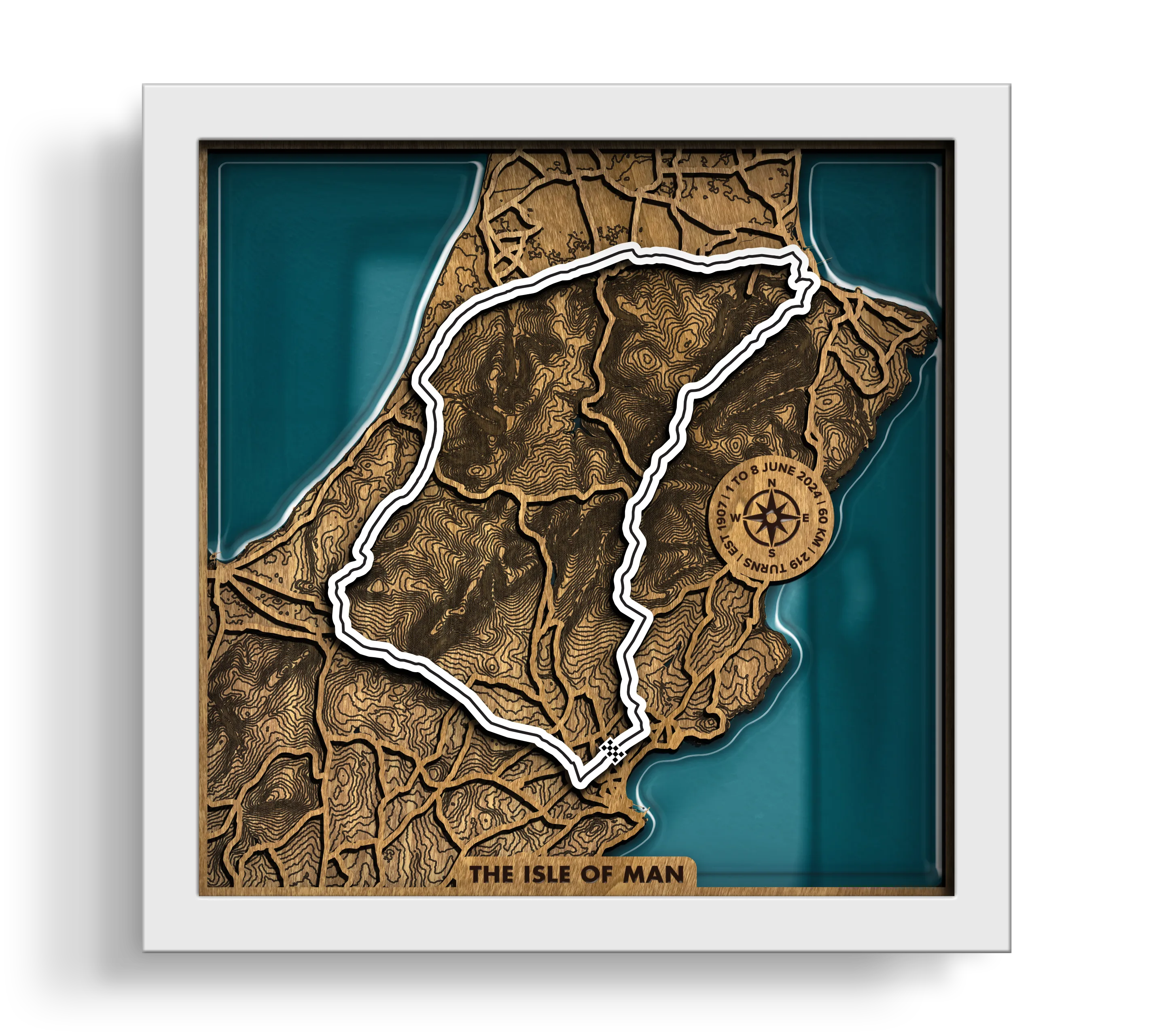 Handcrafted Isle of Man TT Course layered wooden racetrack wall art with an epoxy resin finish in a white frame.