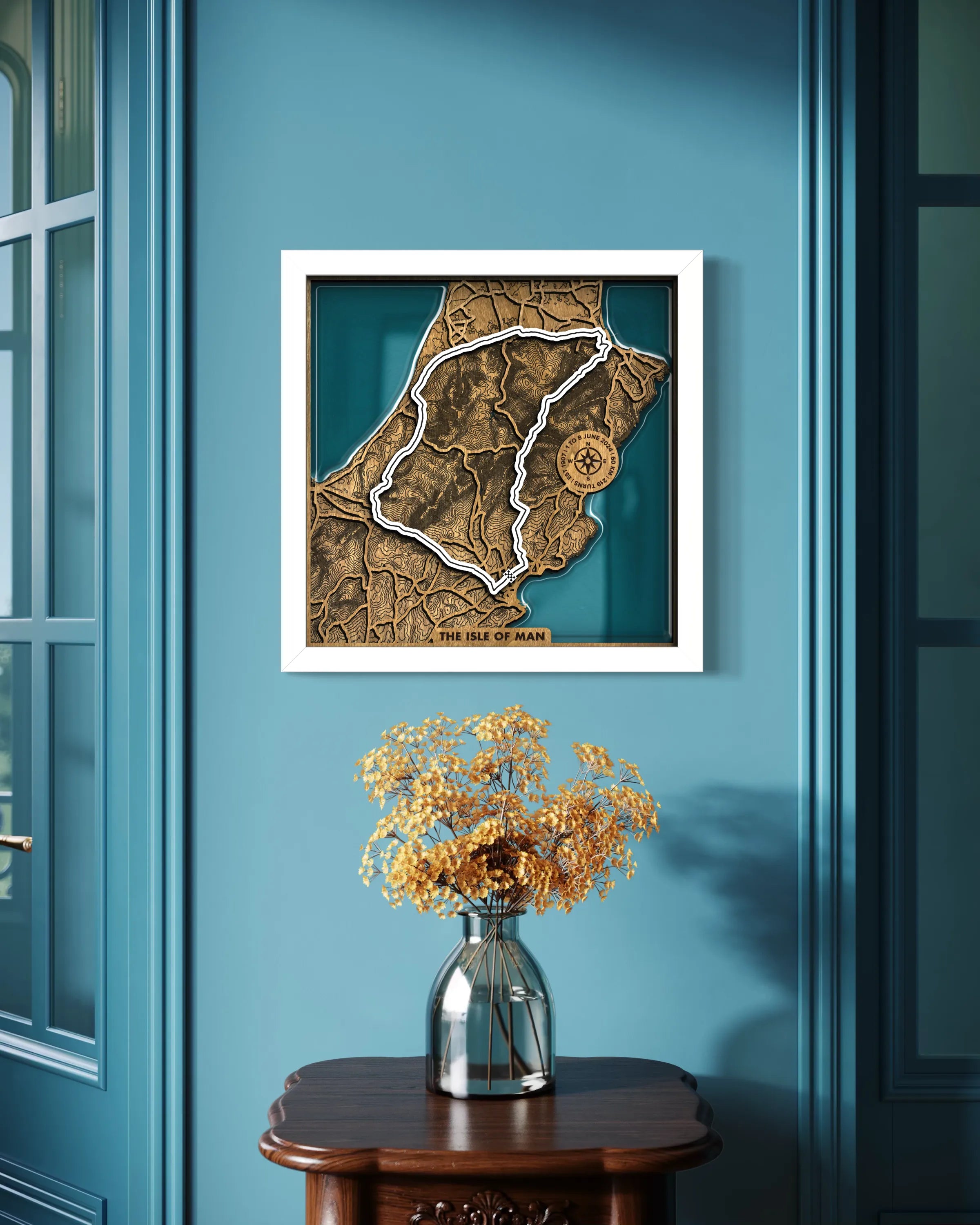 Handcrafted Isle of Man TT Course layered wooden racetrack wall art with epoxy resin displayed in a modern living room.