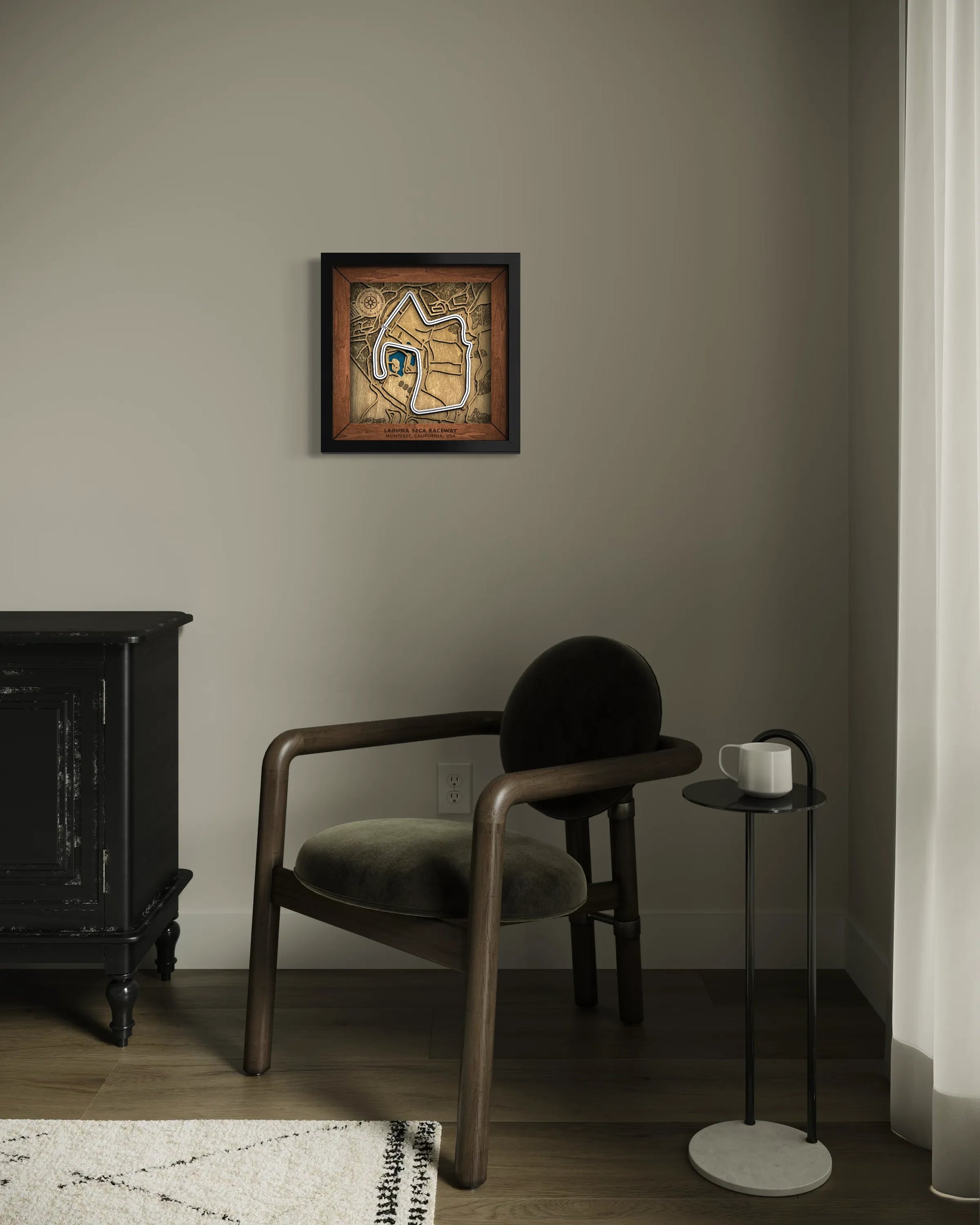 Handcrafted WeatherTech Raceway Laguna Seca layered wooden racetrack wall art displayed in a modern living room.