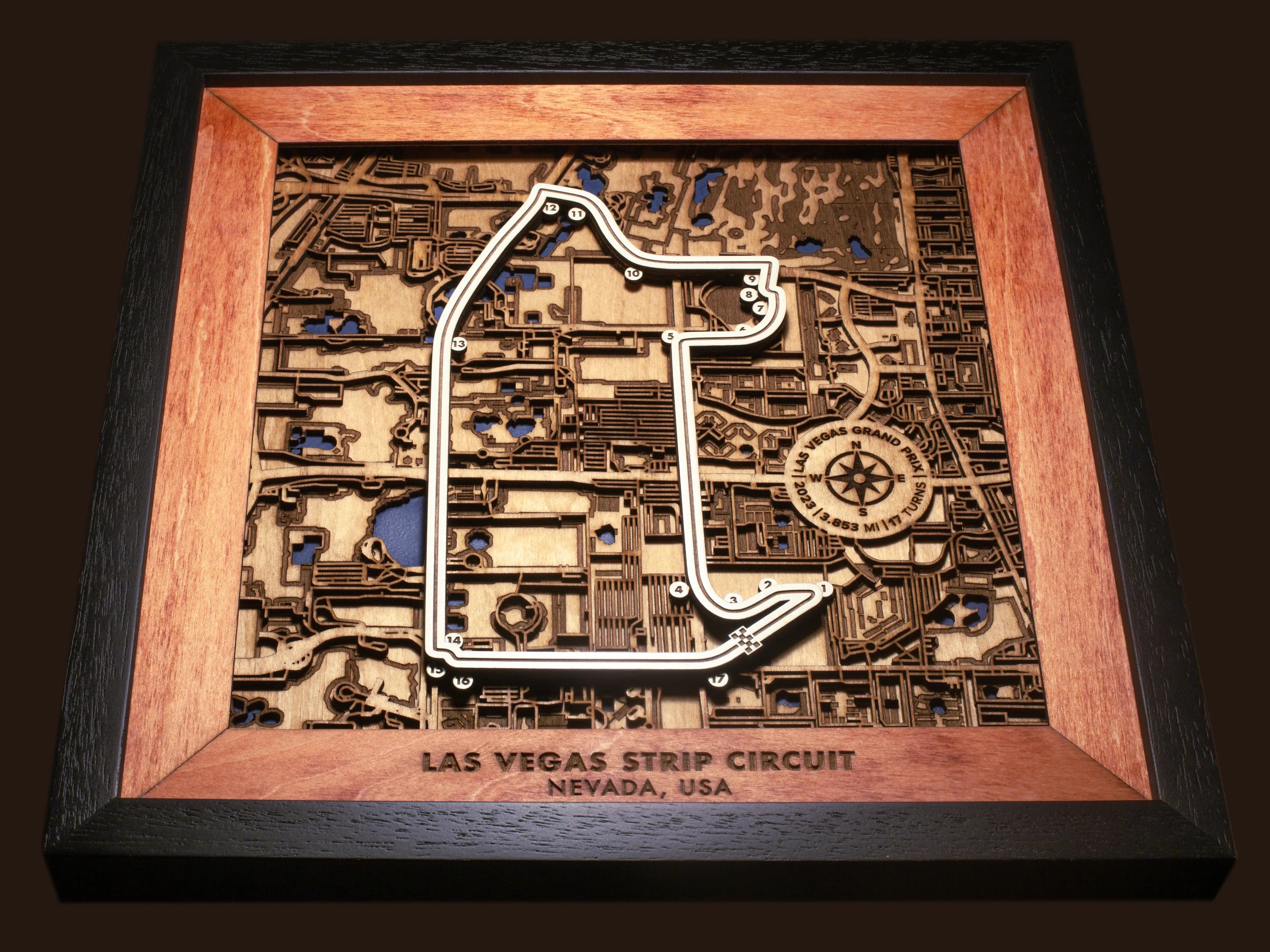 Close-up of the handcrafted layered wood construction and fine details of the Las Vegas Strip Circuit wall art.