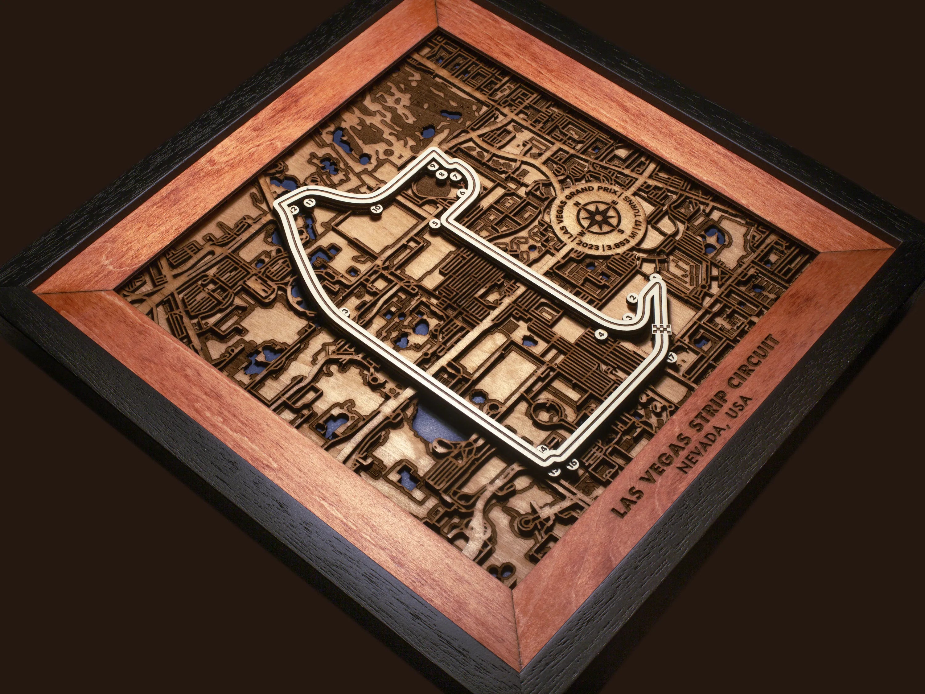 Close-up of the handcrafted layered wood construction and fine details of the Las Vegas Strip Circuit wall art.