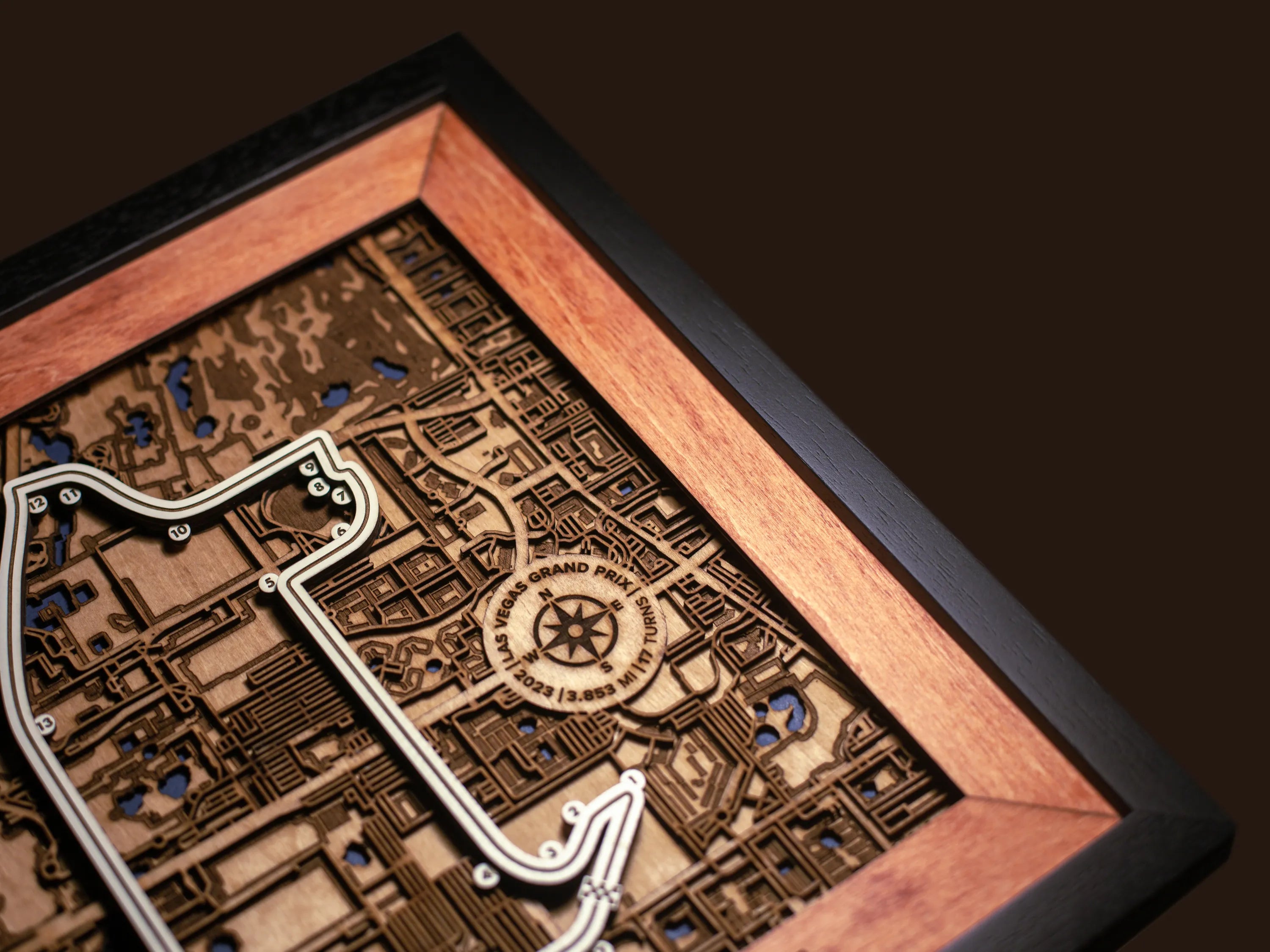 Close-up of the handcrafted layered wood construction and fine details of the Las Vegas Strip Circuit wall art.
