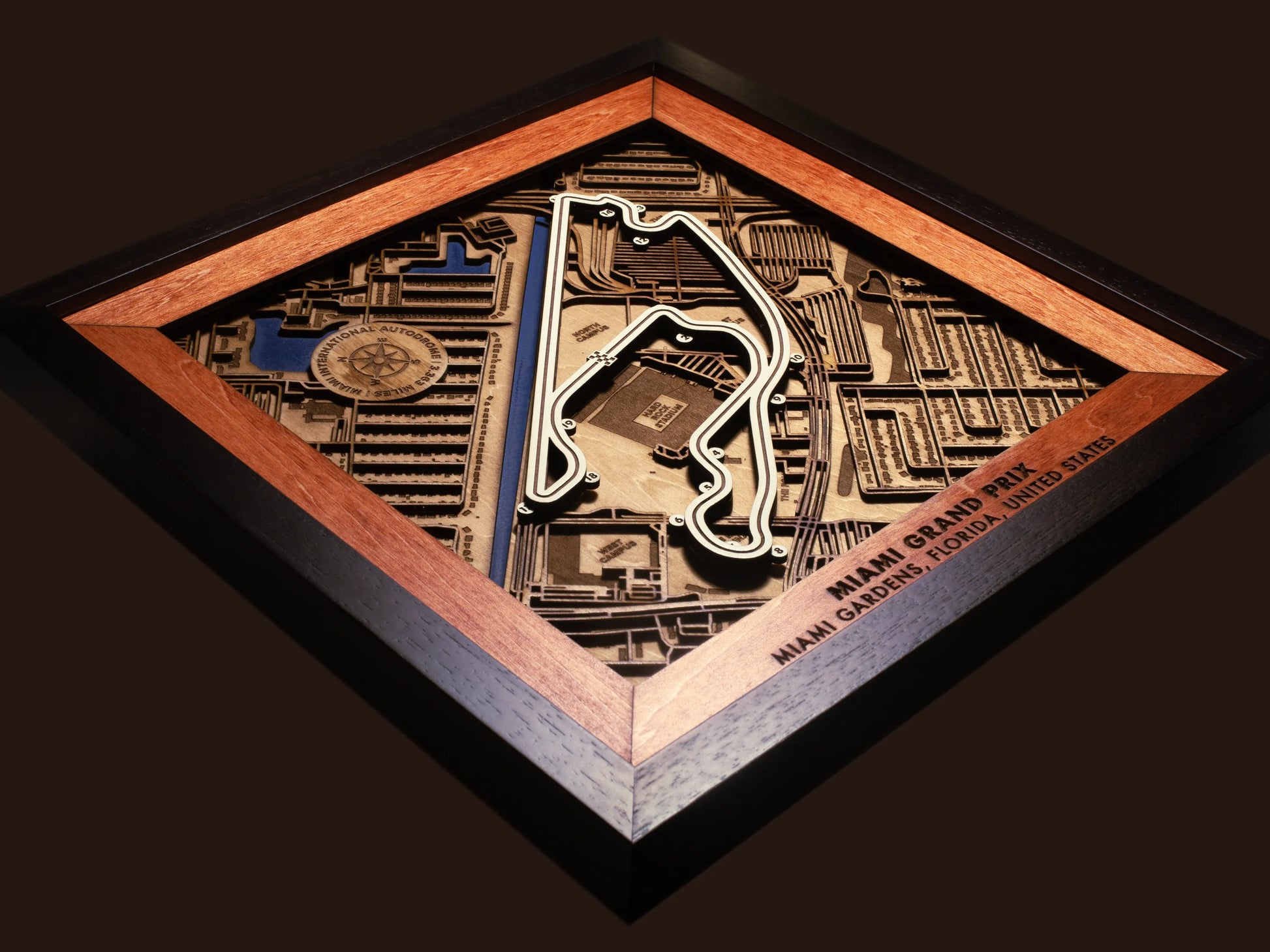 Close-up of the handcrafted layered wood construction and fine details of the Miami International Autodrome wall art.