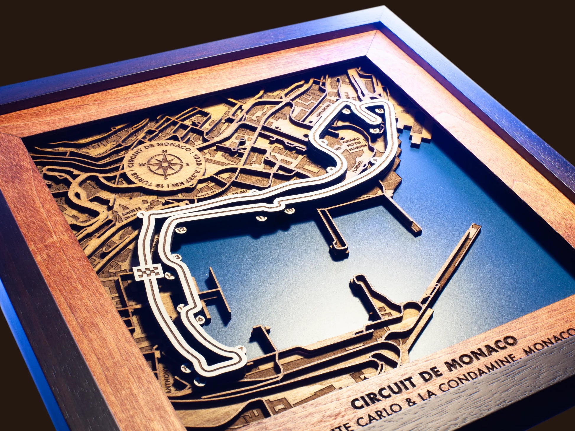 Close-up of the handcrafted layered wood construction and fine details of the Circuit de Monaco wall art.
