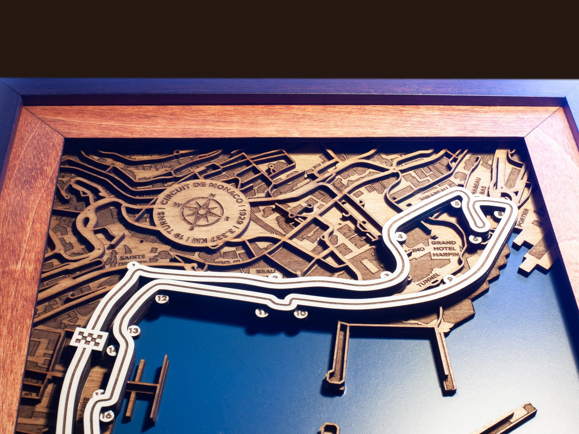 Close-up of the handcrafted layered wood construction and fine details of the Circuit de Monaco wall art.