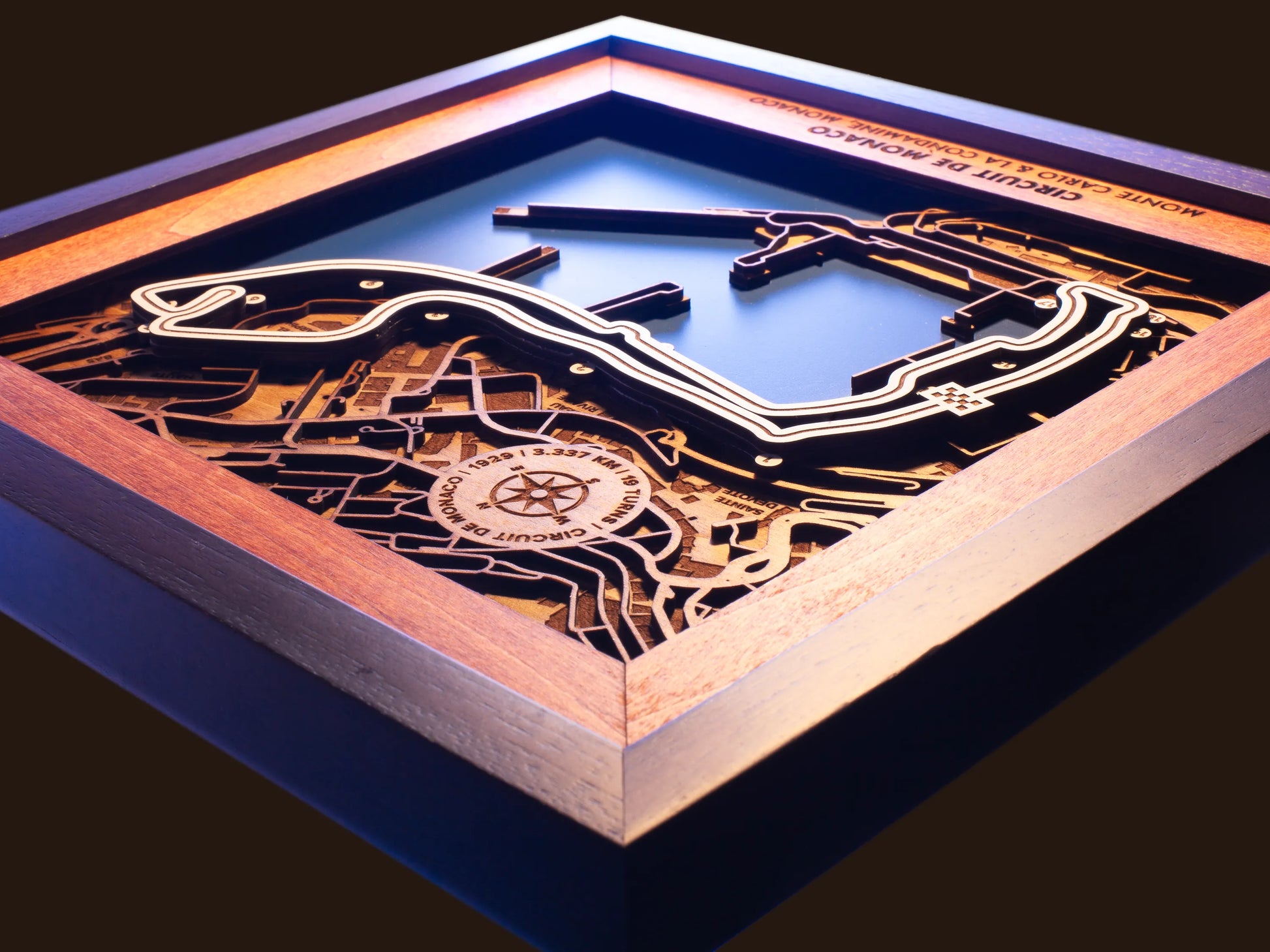 Close-up of the handcrafted layered wood construction and fine details of the Circuit de Monaco wall art.