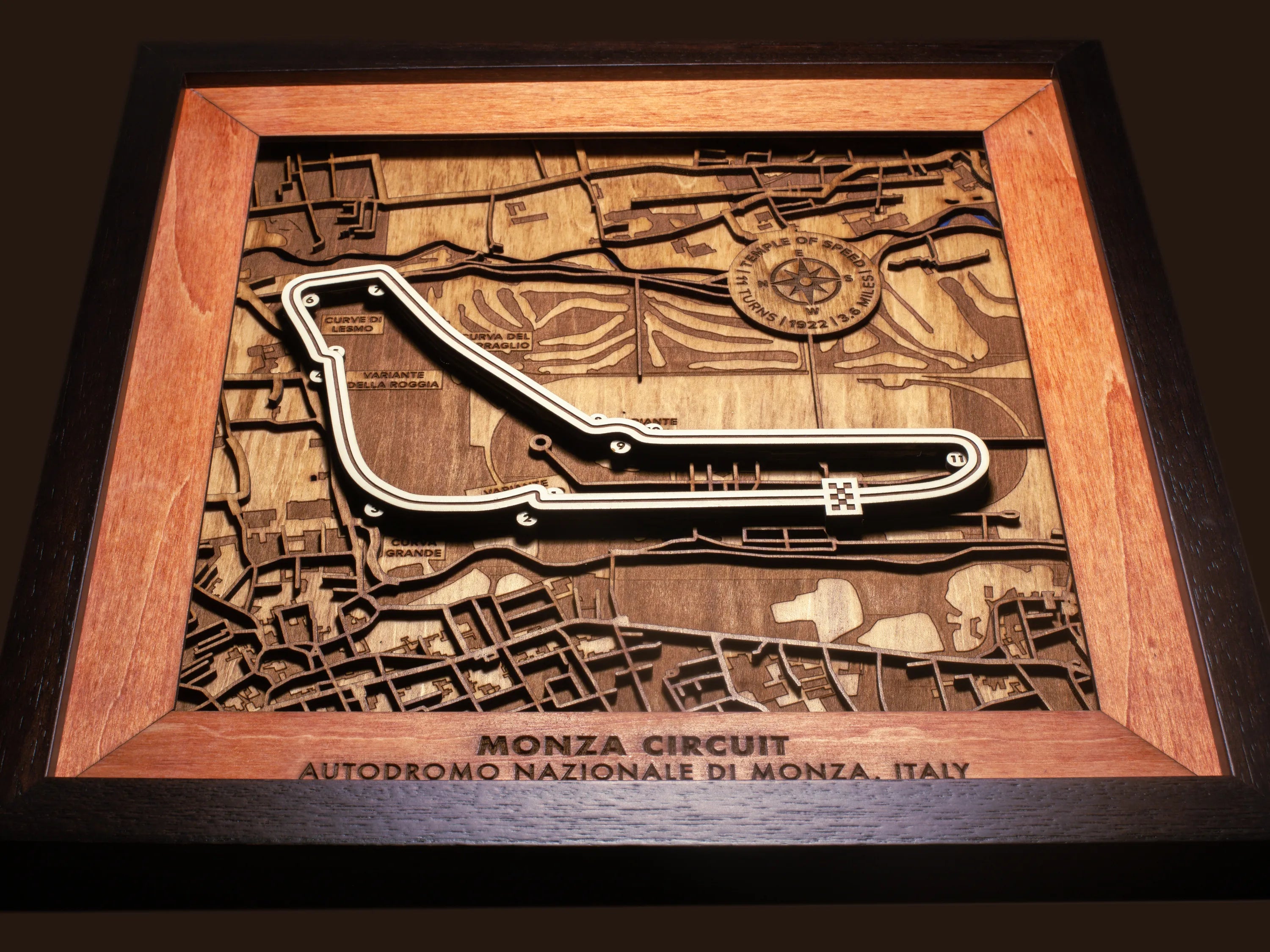 Close-up of the handcrafted layered wood construction and fine details of the Autodromo Nazionale Monza wall art.