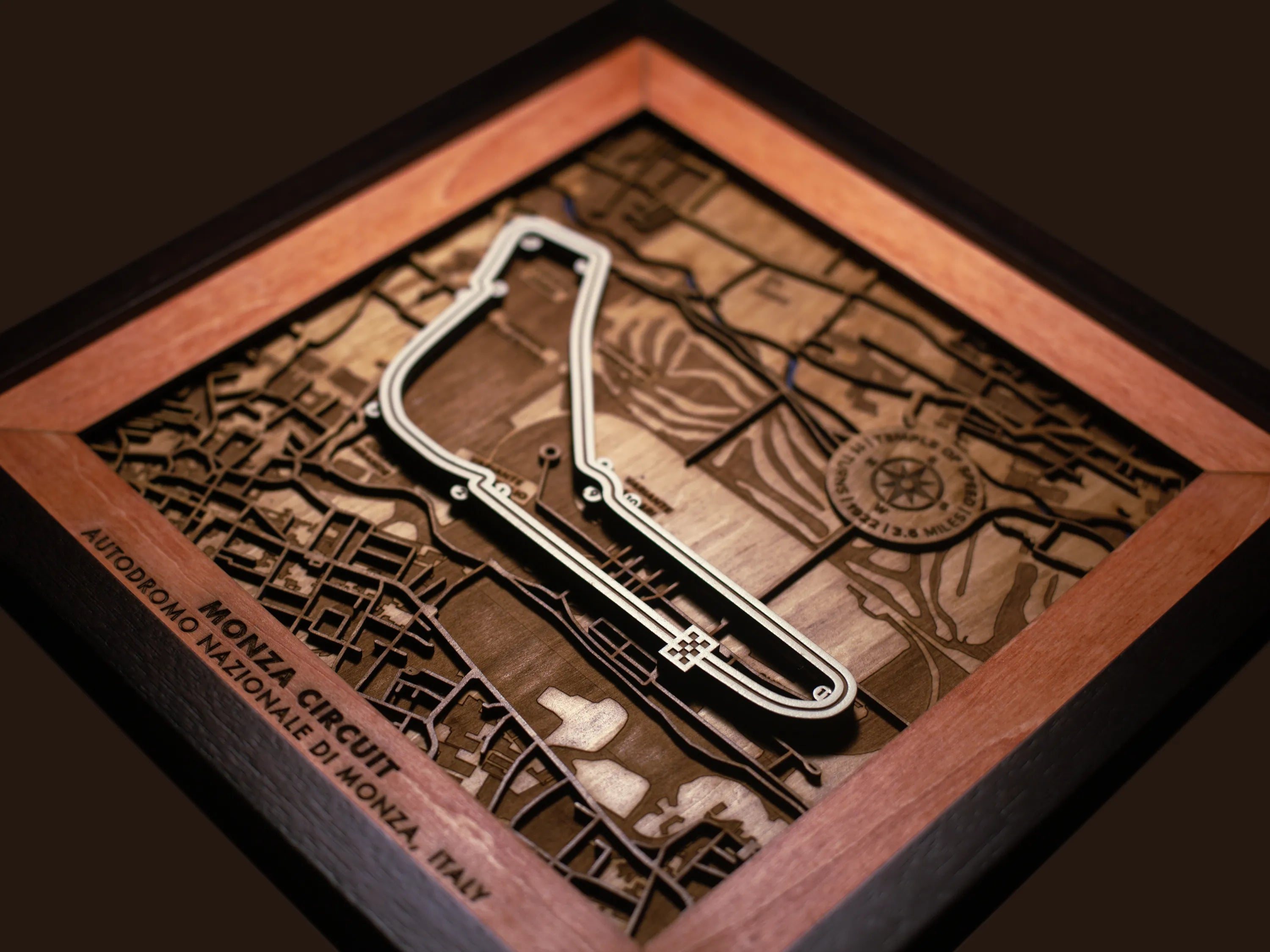 Close-up of the handcrafted layered wood construction and fine details of the Autodromo Nazionale Monza wall art.