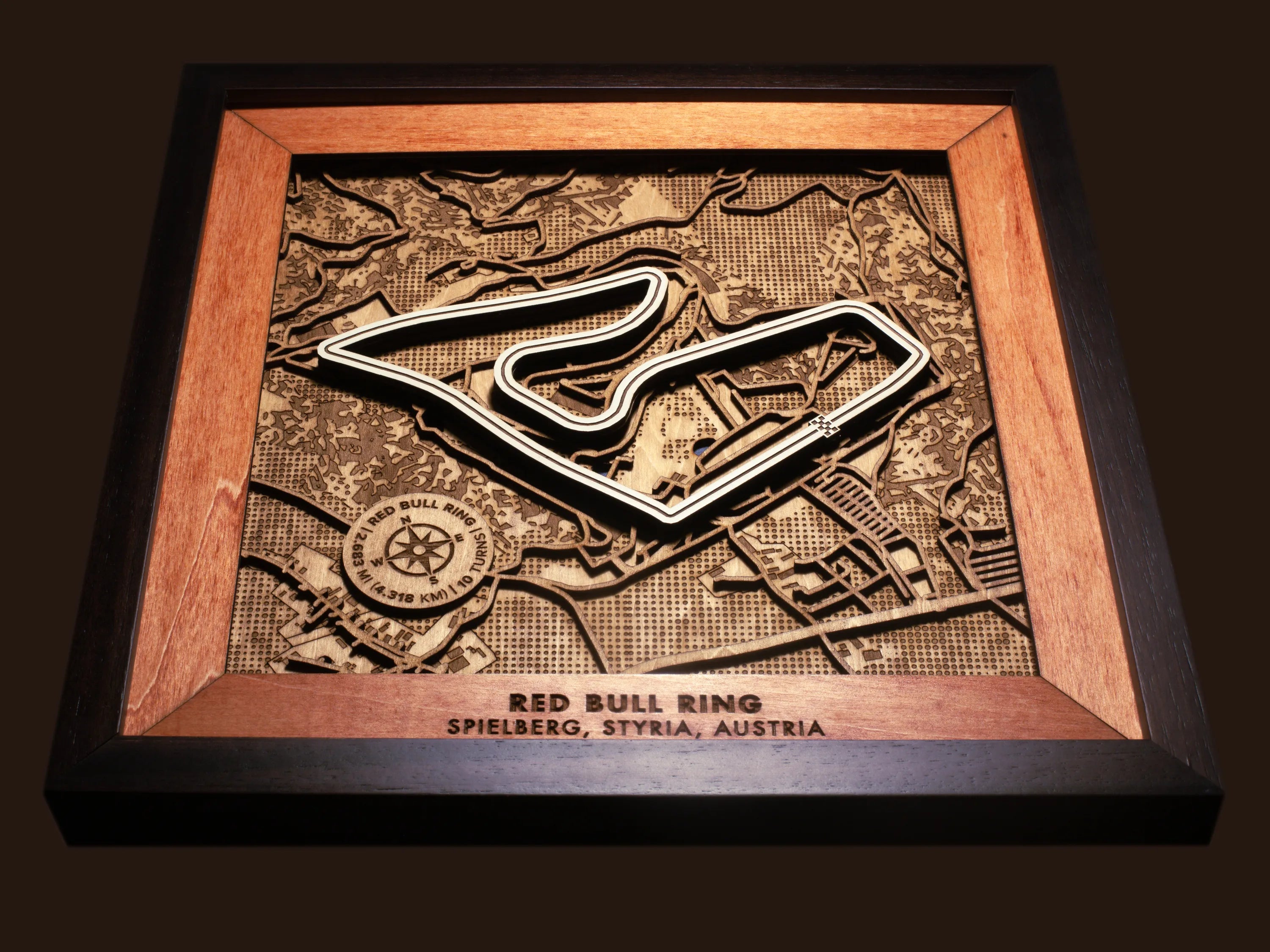 Close-up of the handcrafted layered wood construction and fine details of the Red Bull Ring wall art.
