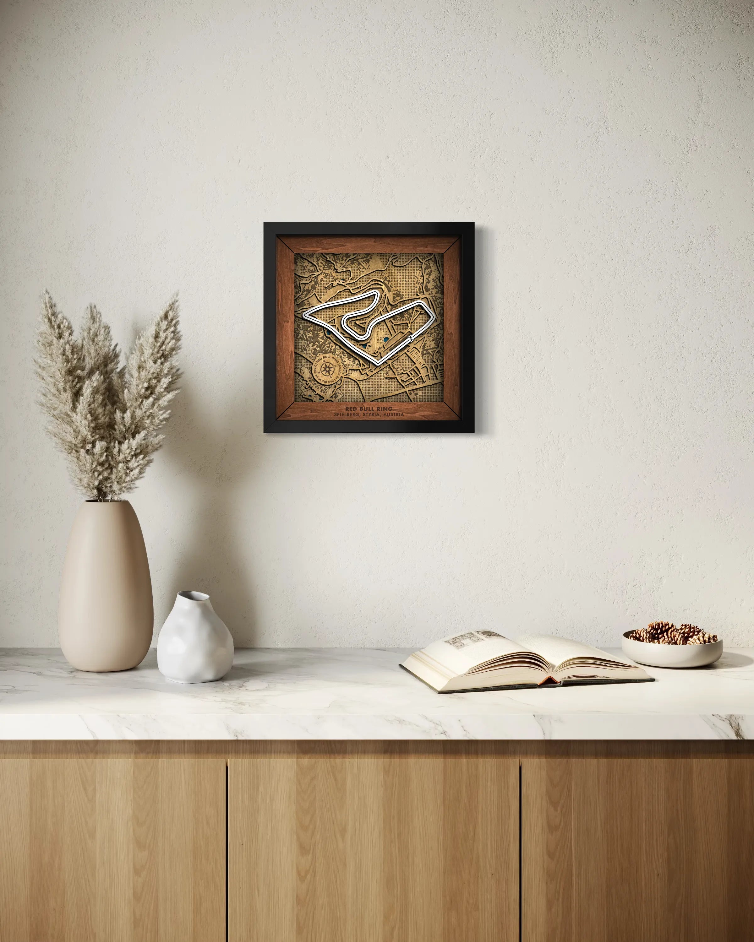 Handcrafted Red Bull Ring layered wooden racetrack wall art displayed in a modern living room.
