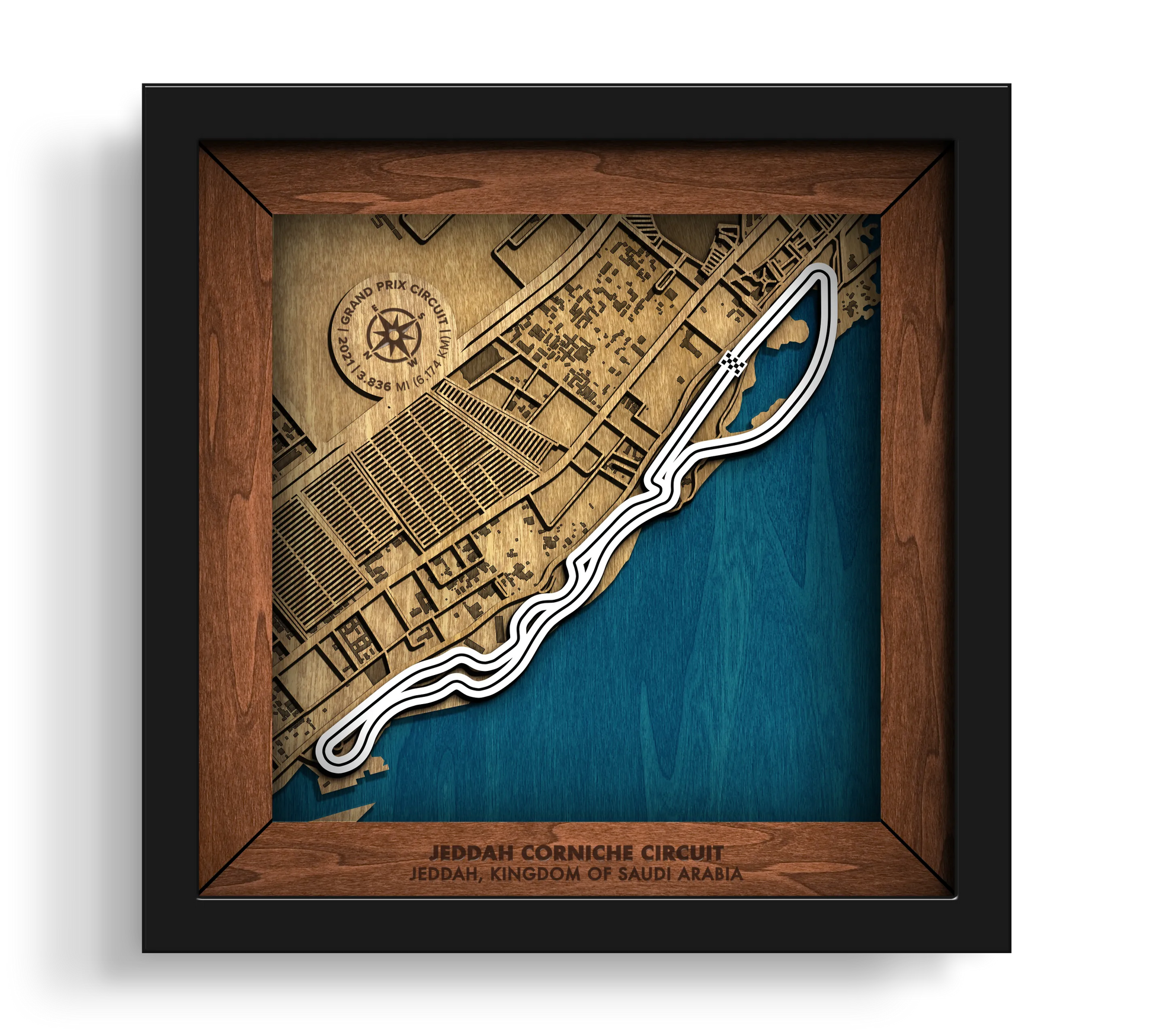 Handcrafted Jeddah Corniche Circuit layered wooden racetrack wall art in a black frame.