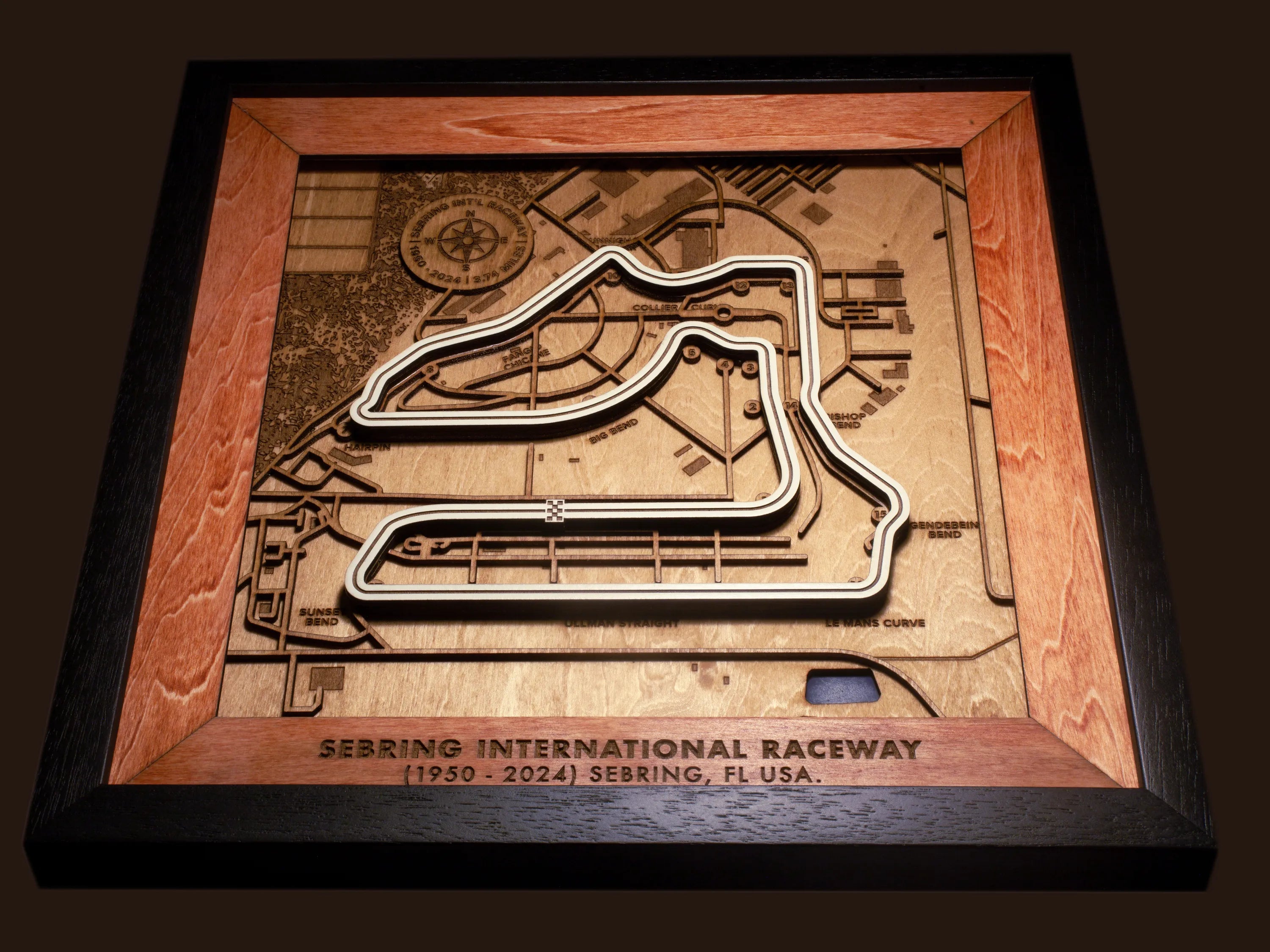 Close-up of the handcrafted layered wood construction and fine details of the Sebring International Raceway wall art.