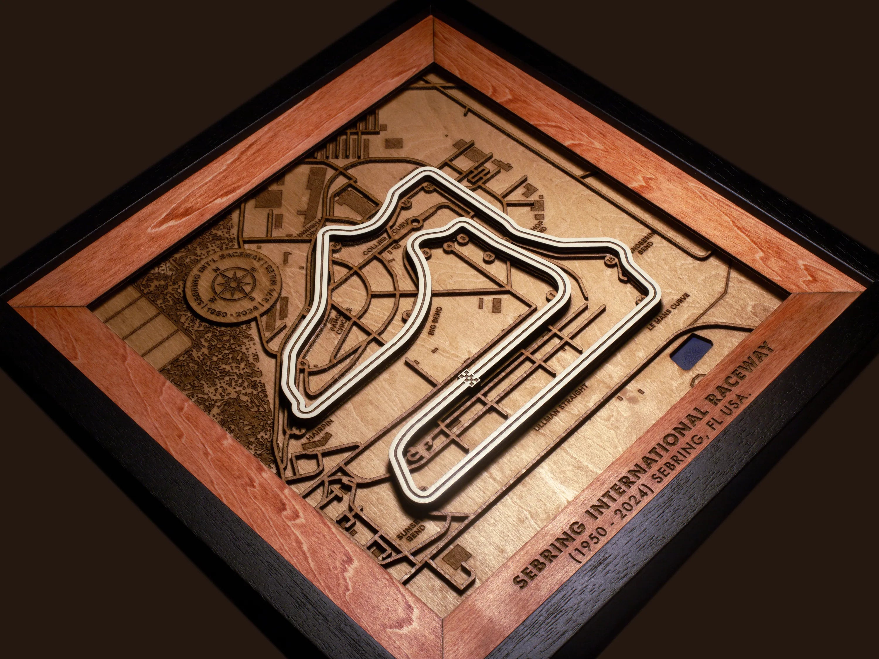 Close-up of the handcrafted layered wood construction and fine details of the Sebring International Raceway wall art.