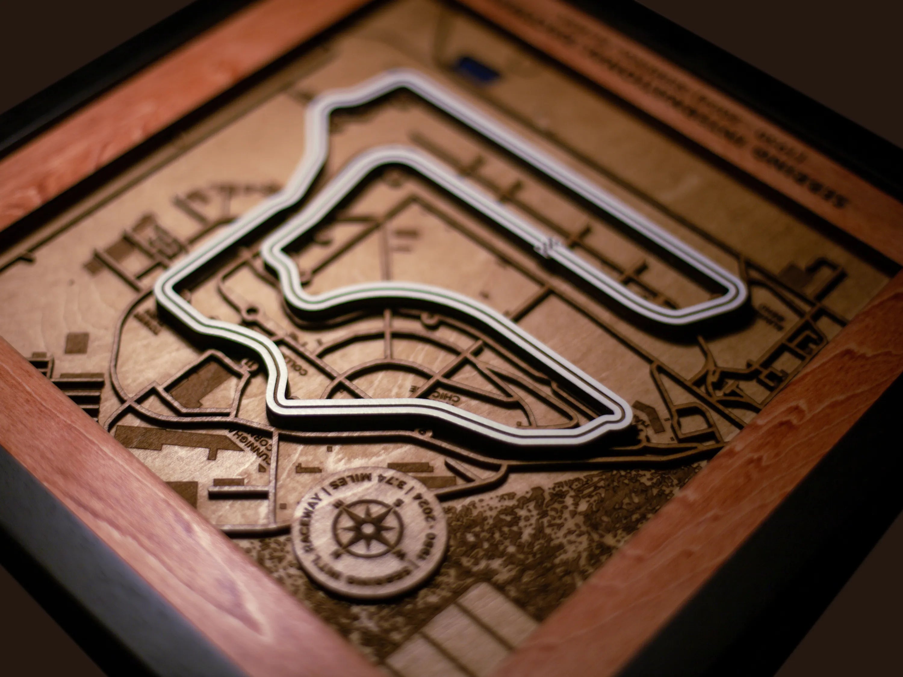 Close-up of the handcrafted layered wood construction and fine details of the Sebring International Raceway wall art.