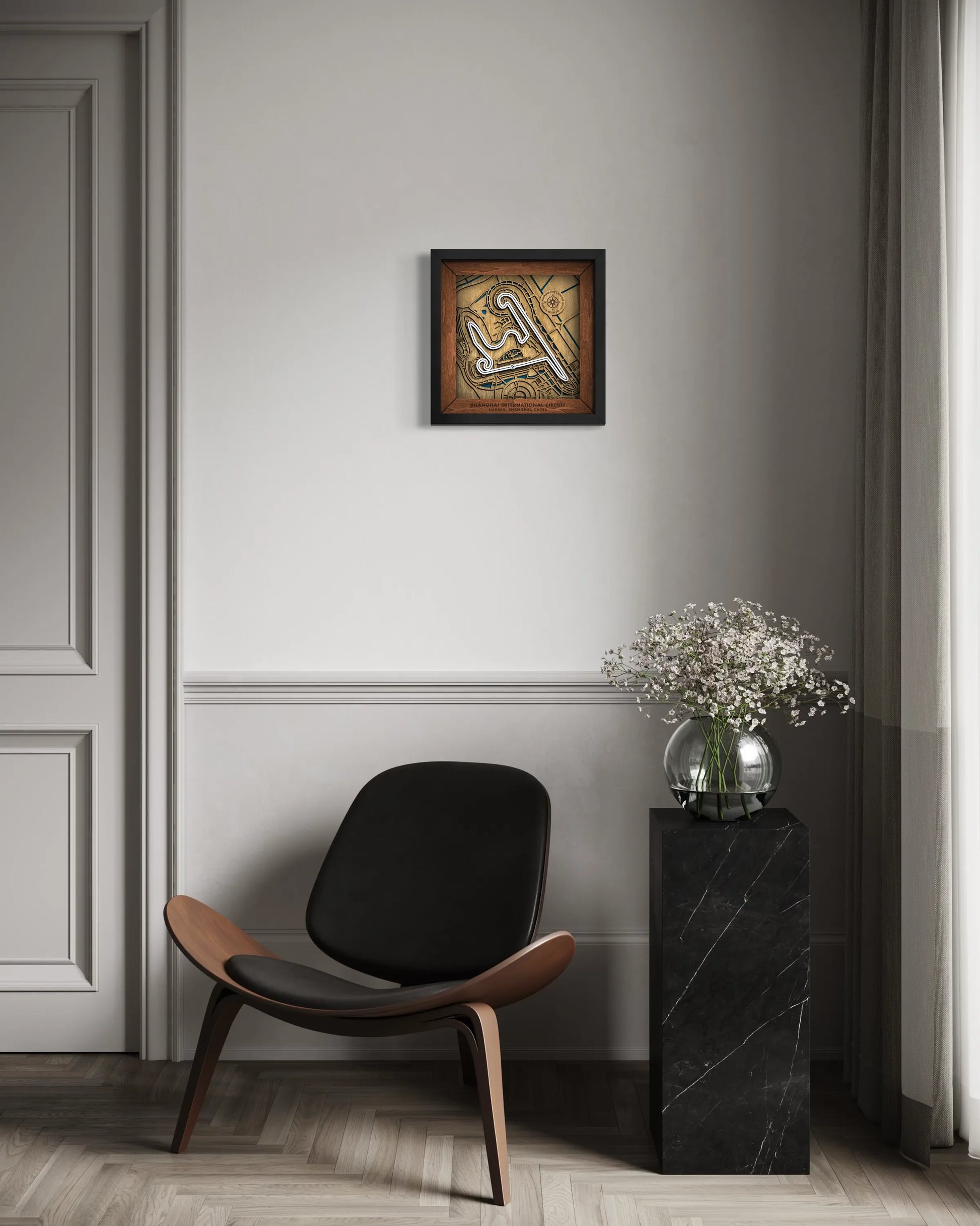 Handcrafted Shanghai International Circuit layered wooden racetrack wall art displayed in a modern living room.