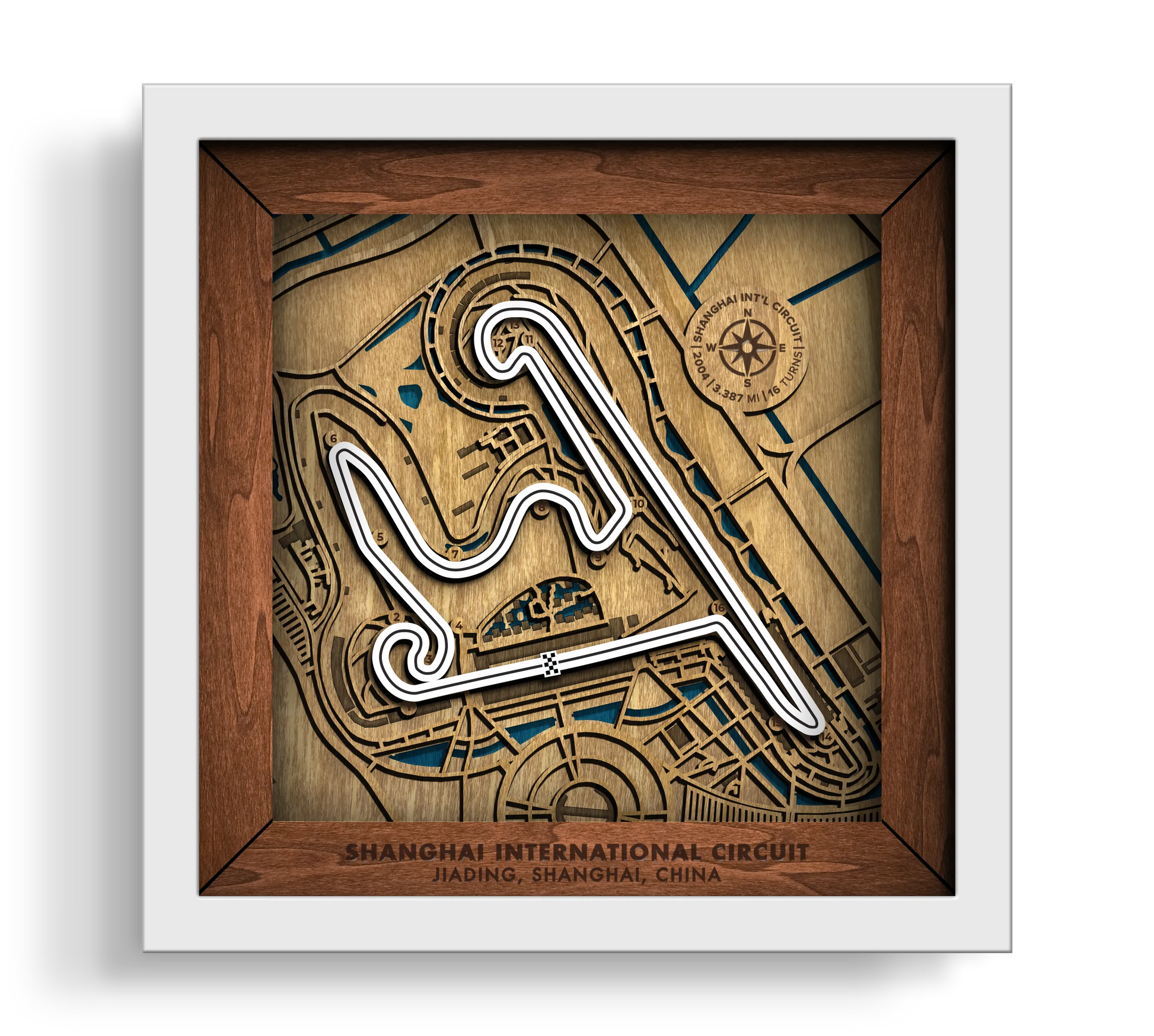 Handcrafted Shanghai International Circuit layered wooden racetrack wall art in a white frame.