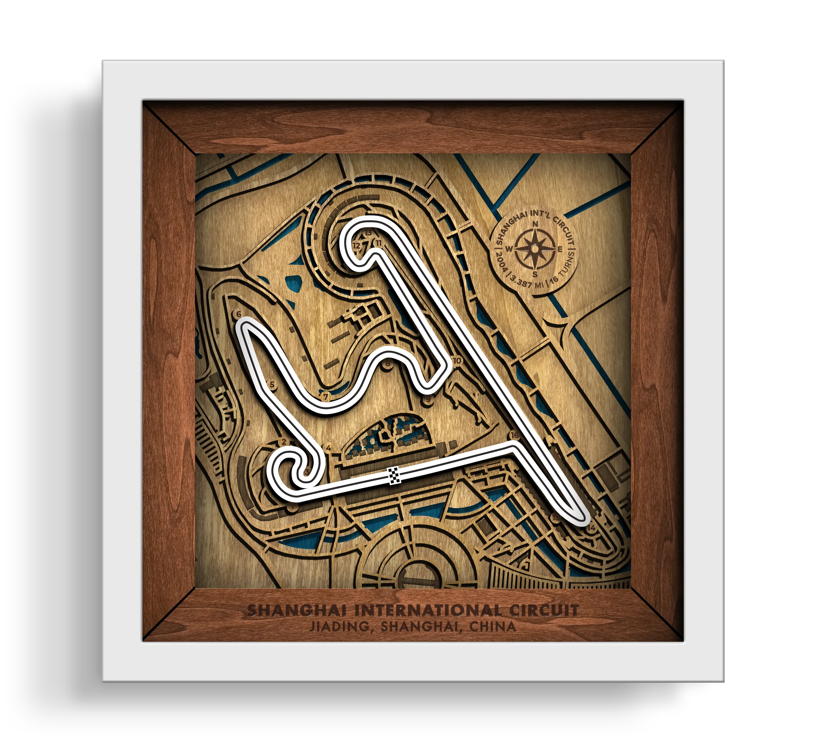 Handcrafted Shanghai International Circuit layered wooden racetrack wall art in a white frame.