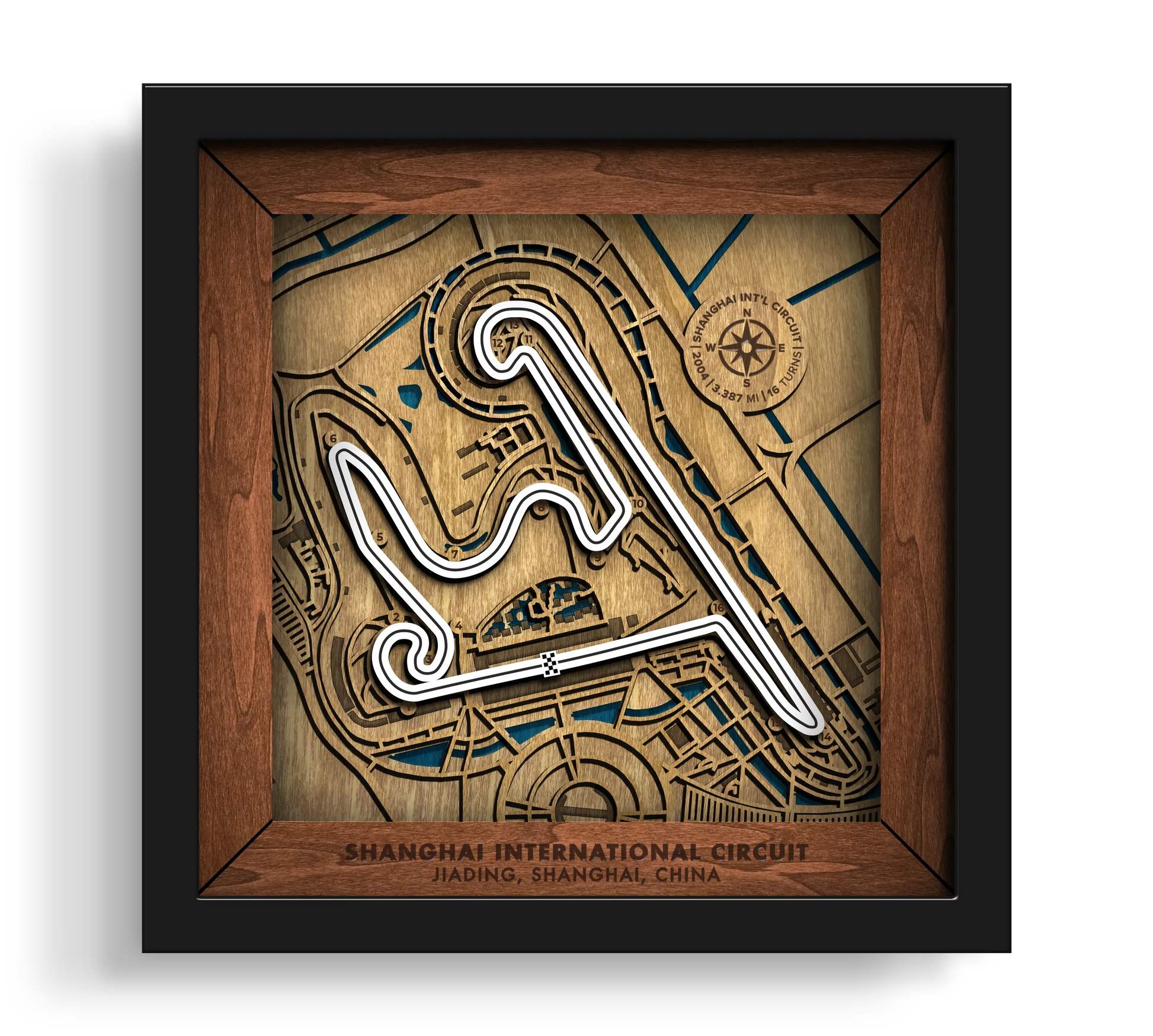 Handcrafted Shanghai International Circuit layered wooden racetrack wall art in a black frame.